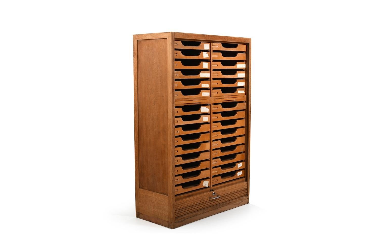 Hans J. Wegner tambour door cabinet with 30 drawers. Made in oak and drawers in birch wood. Prod. 1940s for the Aarhus city hall by Plan Møbler Denmark.