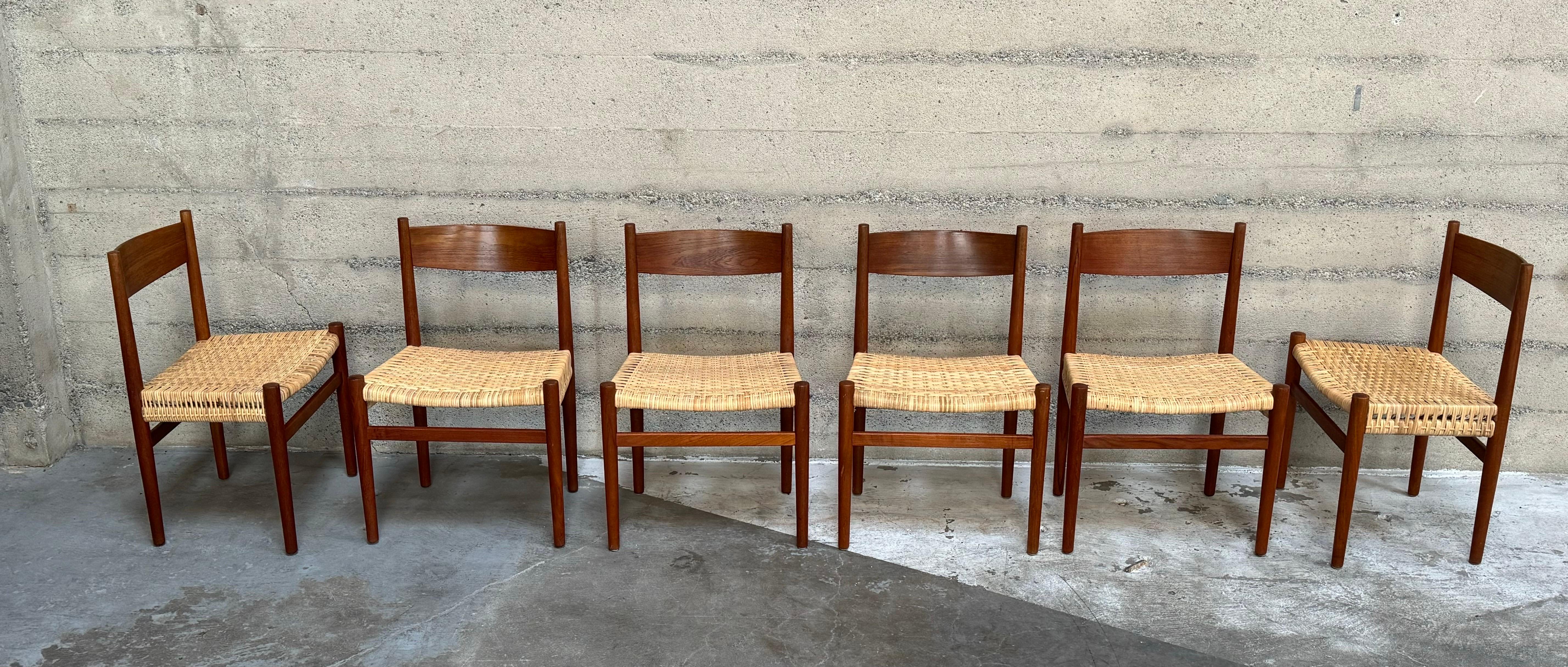 Model CH40 dining chairs in Teak, by Hans J. Wegner for Carl Hansen. Made in Denmark 1960s.
These are a rare model and are sold as a set of six. Freshly woven cane seats will darken with use. Elegantly curved backrests and wide seats provide a