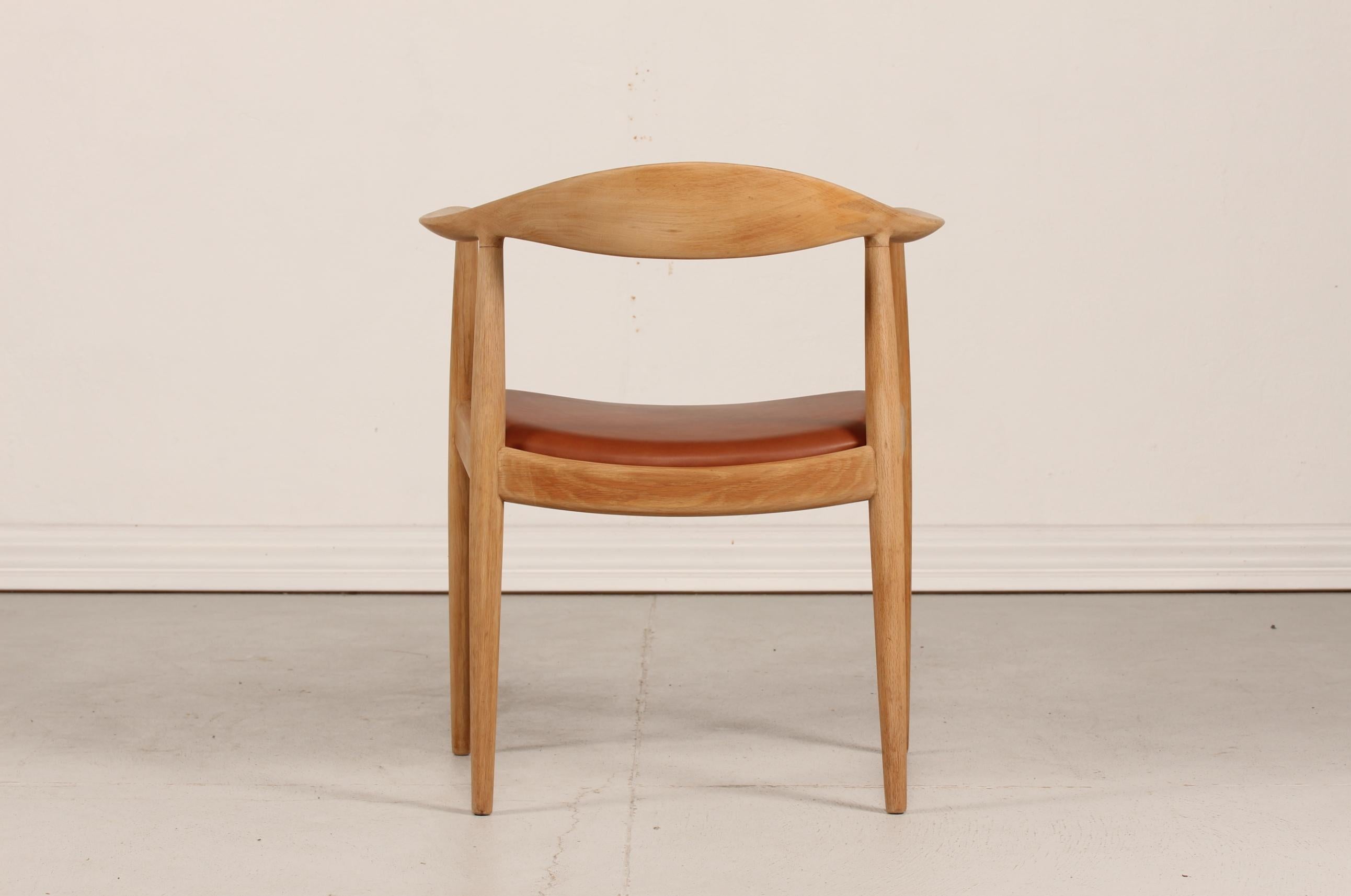 The chair or the round chair model 503 by Danish designer Hans J. Wegner in 1950.
It's made of genuine oak with soap treatment and has got a new aniline walnut colored leather seat cover.
Backstamp under the seat in the frame for the manufacturer