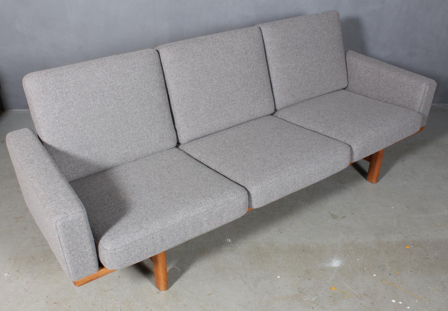 Hans J. Wegner three-seat sofa new upholstered with Divina wool in 100 % New Zealand wool.

Original Epeda cushions.

Frame in solid oak.

Model 236/3, produced by GETAMA.