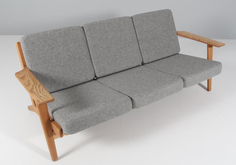 Hans J. Wegner three-seat sofa made of solid soap treated oak.

New upholstered with Hallingdal 130 from Kvadrat

Model 290, made by GETAMA.

