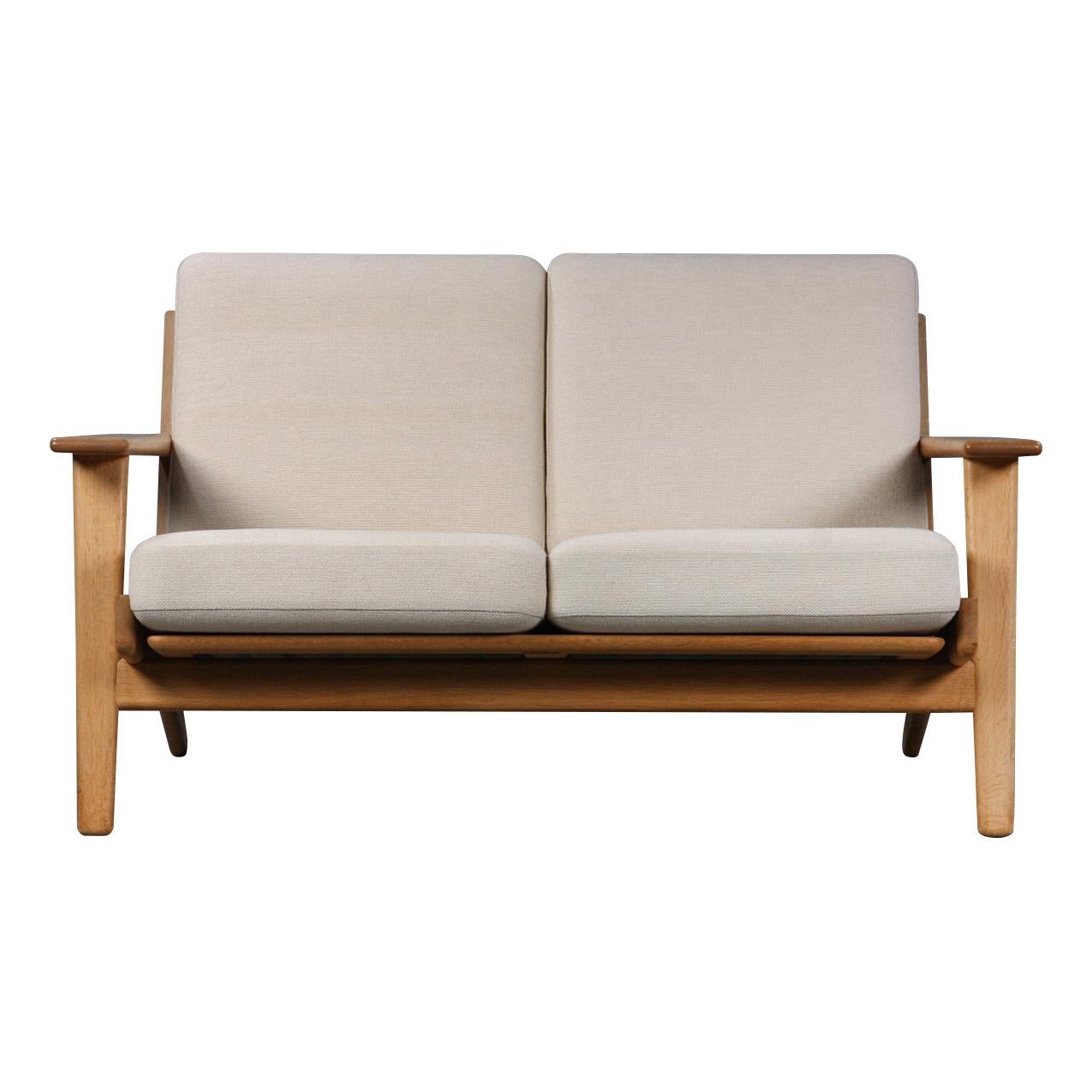 Gorgeous vintage two-seat sofa model GE-290/2 designed by Hans J. Wegner for GETAMA, Denmark. Wegner is widely considered to be one of the leading figures in 20th century furniture design. His furniture designs unite form and function, furnishing