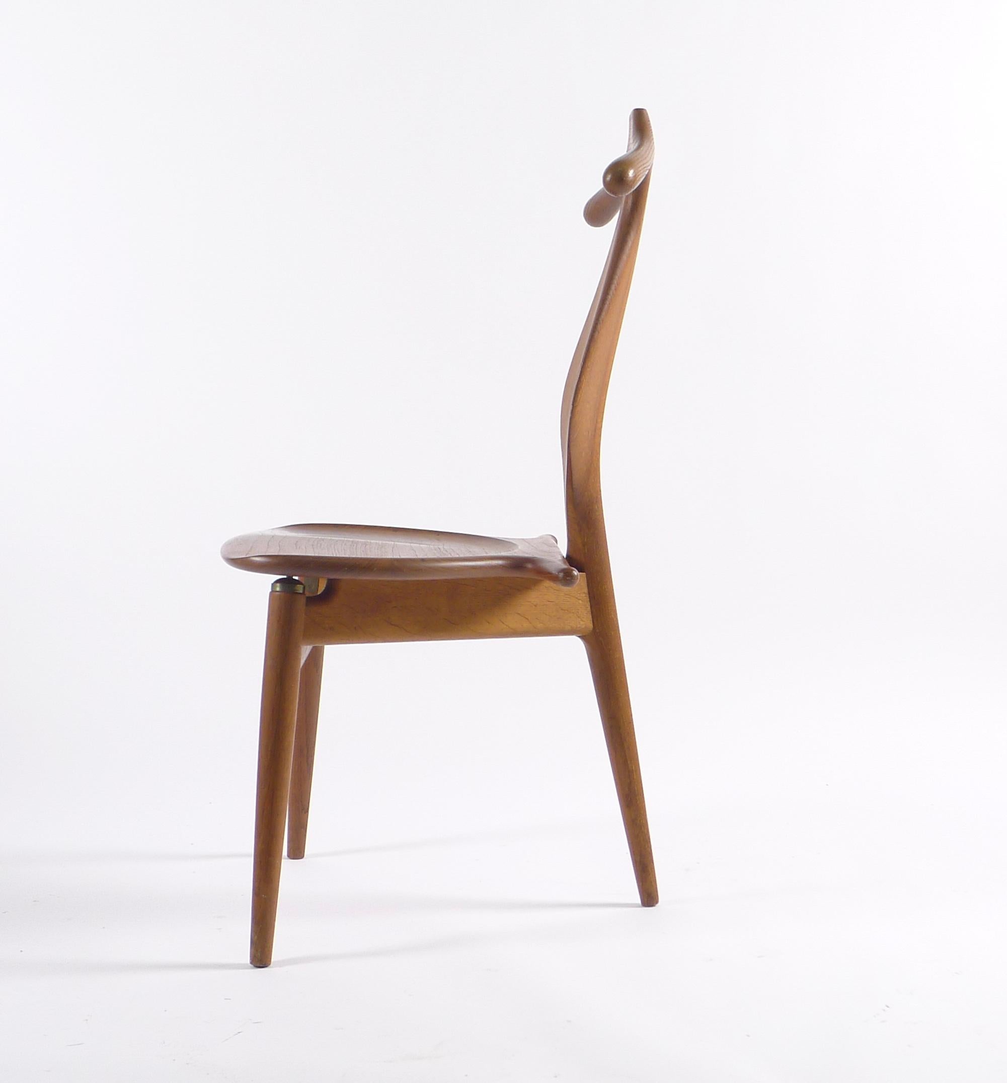 Hans J Wegner (1914-2007), Valet Chair, model no. JH540, teak and oak, original edition produced by Johannes Hansen, 1953. 

Underside impressed with manufacturer’s mark: JOHANNES HANSEN/COPENHAGEN/DENMARK

This rare chair is one of the original