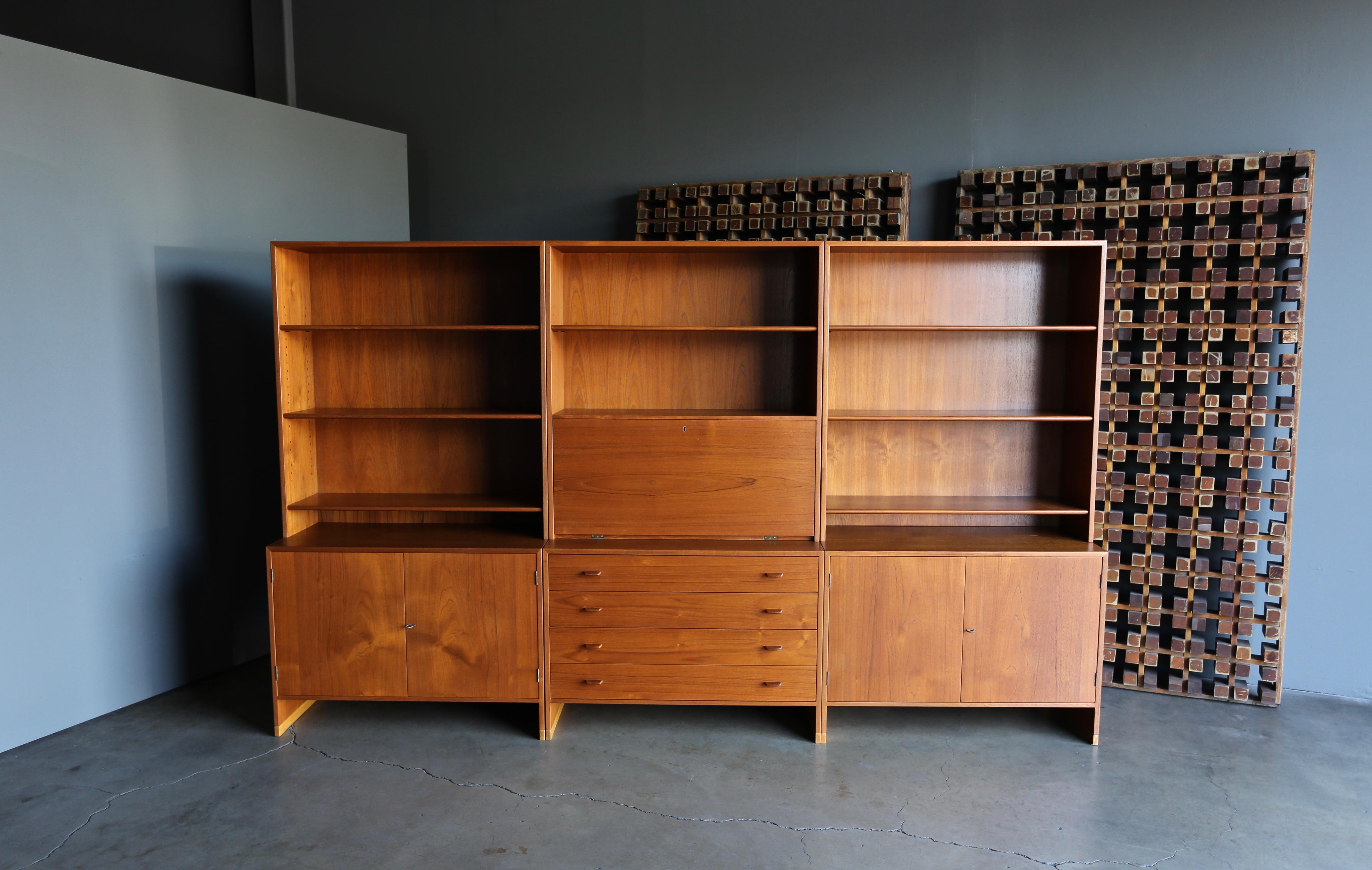 Hans J. Wegner wall unit for Ry Møbler, circa 1960. This wall unit can be separated into three individual sections. This piece has been professionally restored.

With all three sections together this wall unit measures: 118