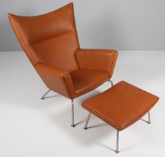 Hans J. Wegner wing chair and ottoman in full grain leather, model CH445