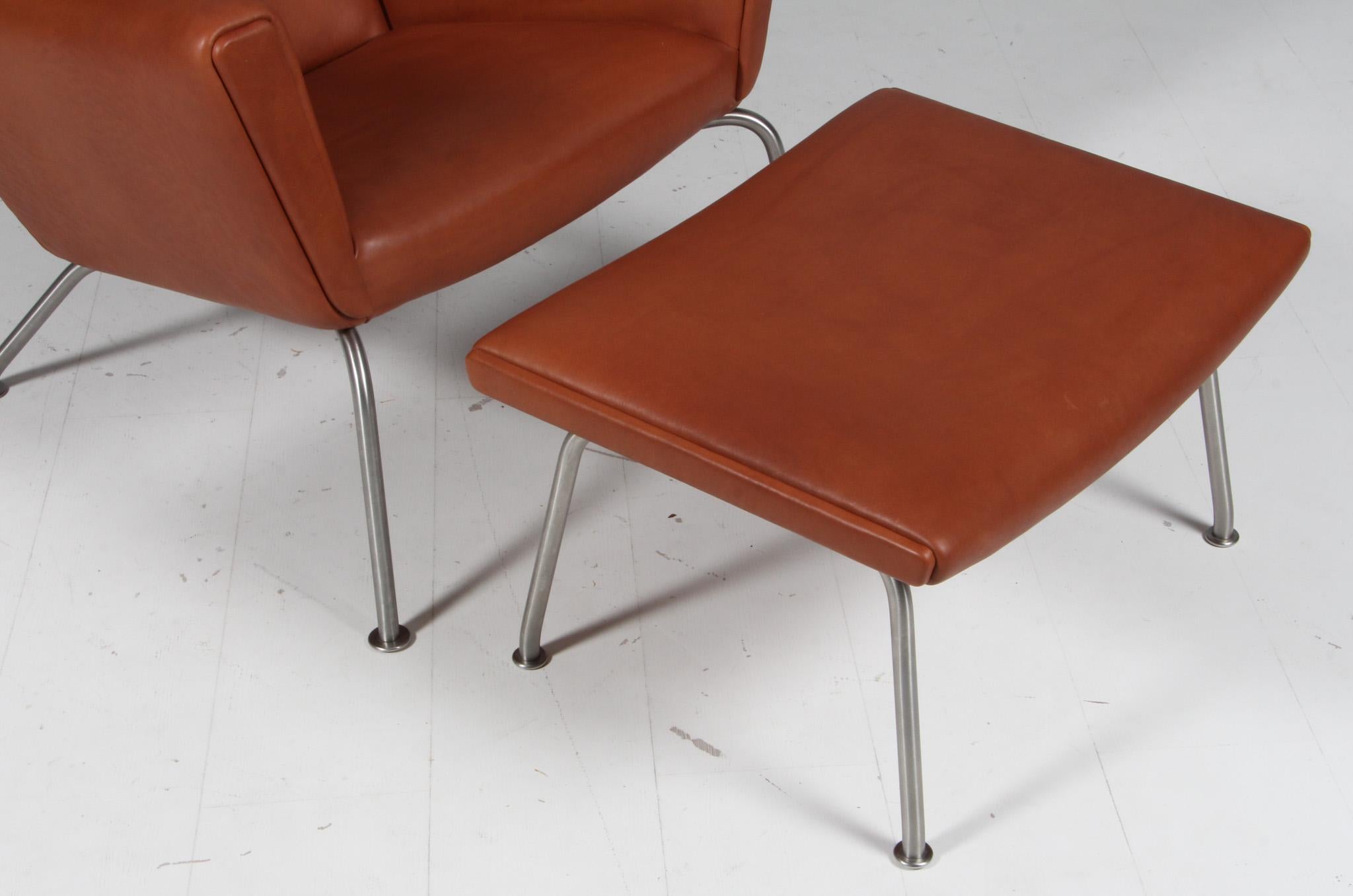 Scandinavian Modern Hans J. Wegner wing chair and ottoman in full grain leather, model CH445