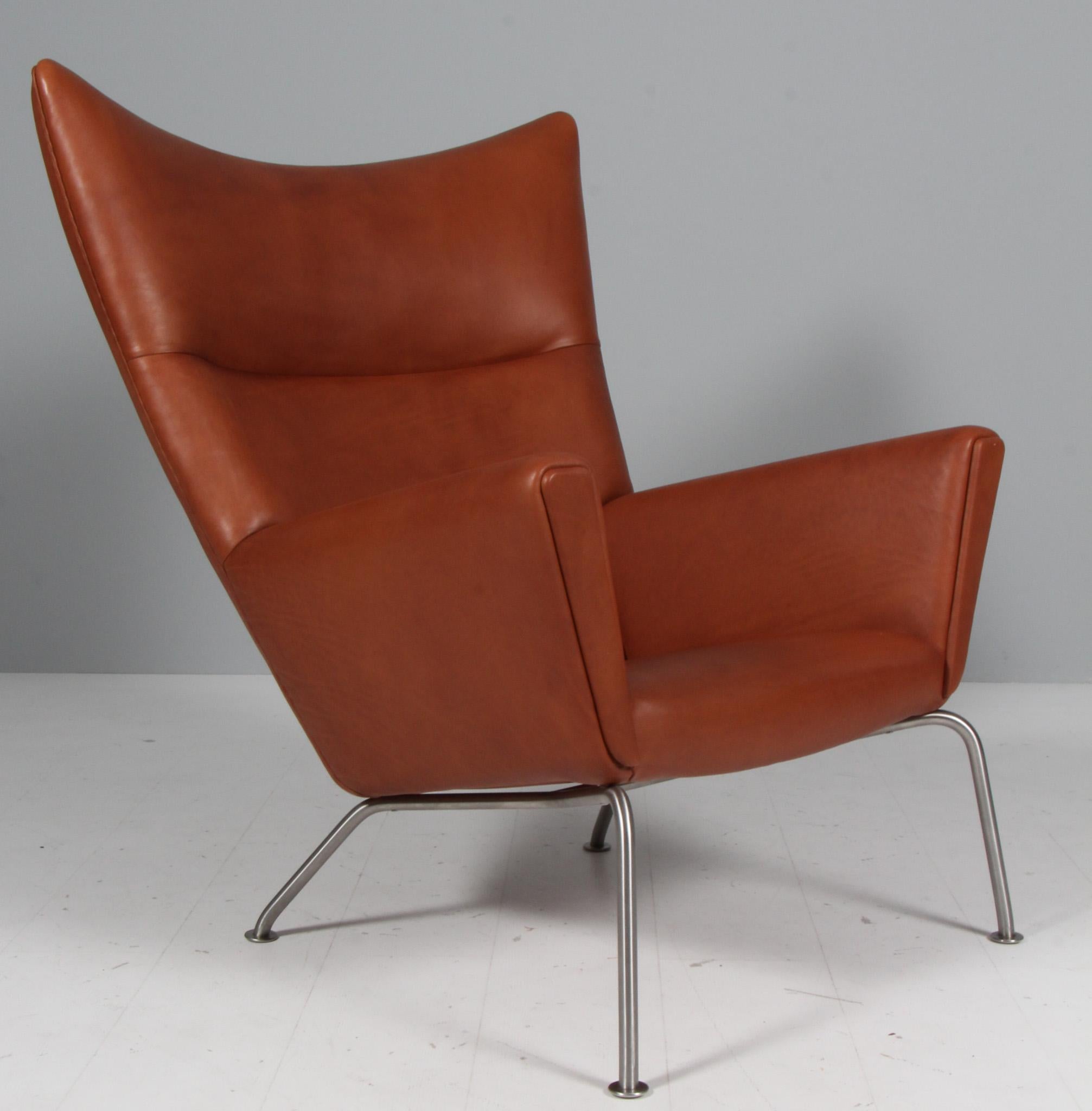 Danish Hans J. Wegner wing chair and ottoman in full grain leather, model CH445