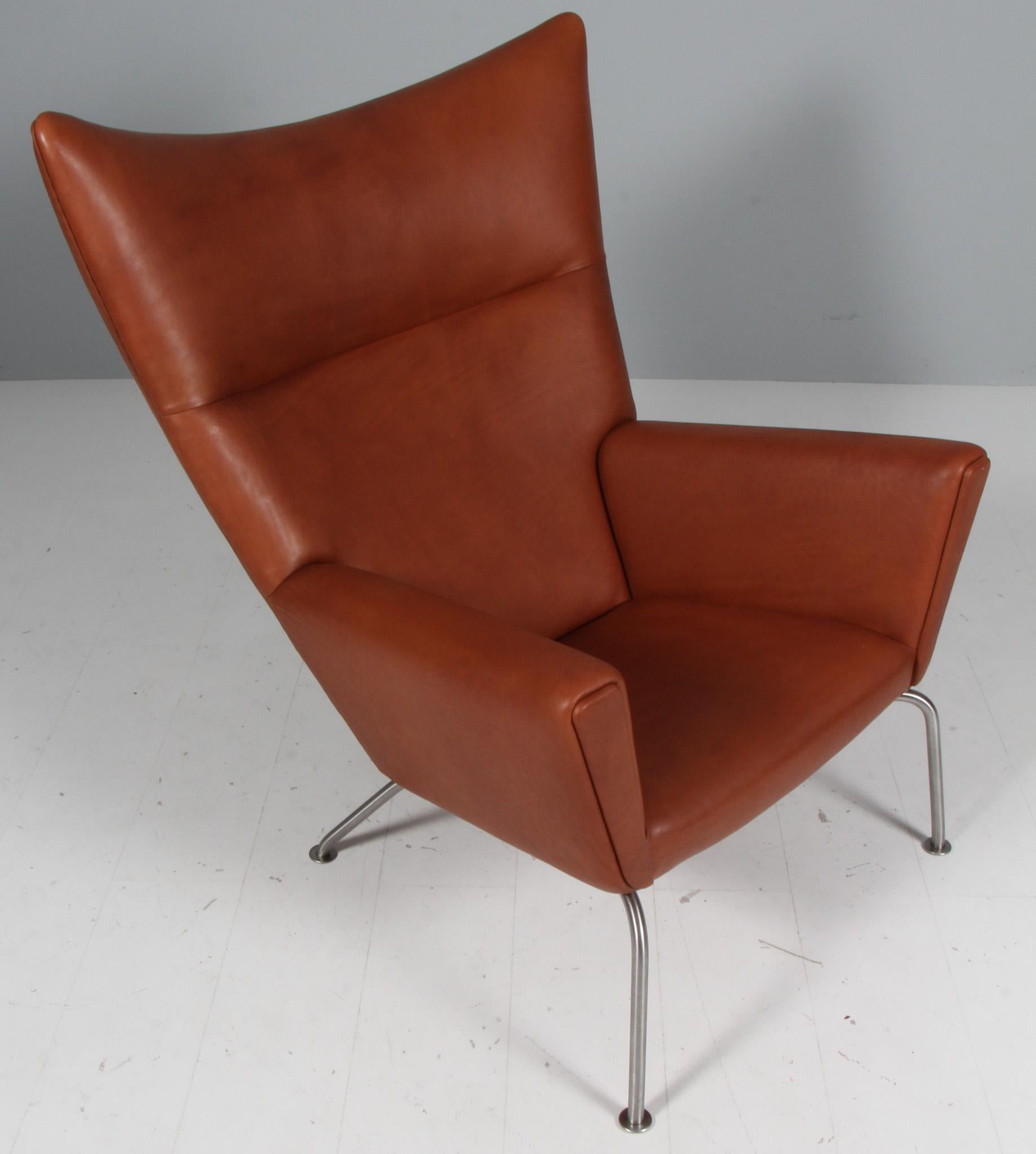 Hans J. Wegner wing chair and ottoman in full grain leather, model CH445 In Excellent Condition In Esbjerg, DK