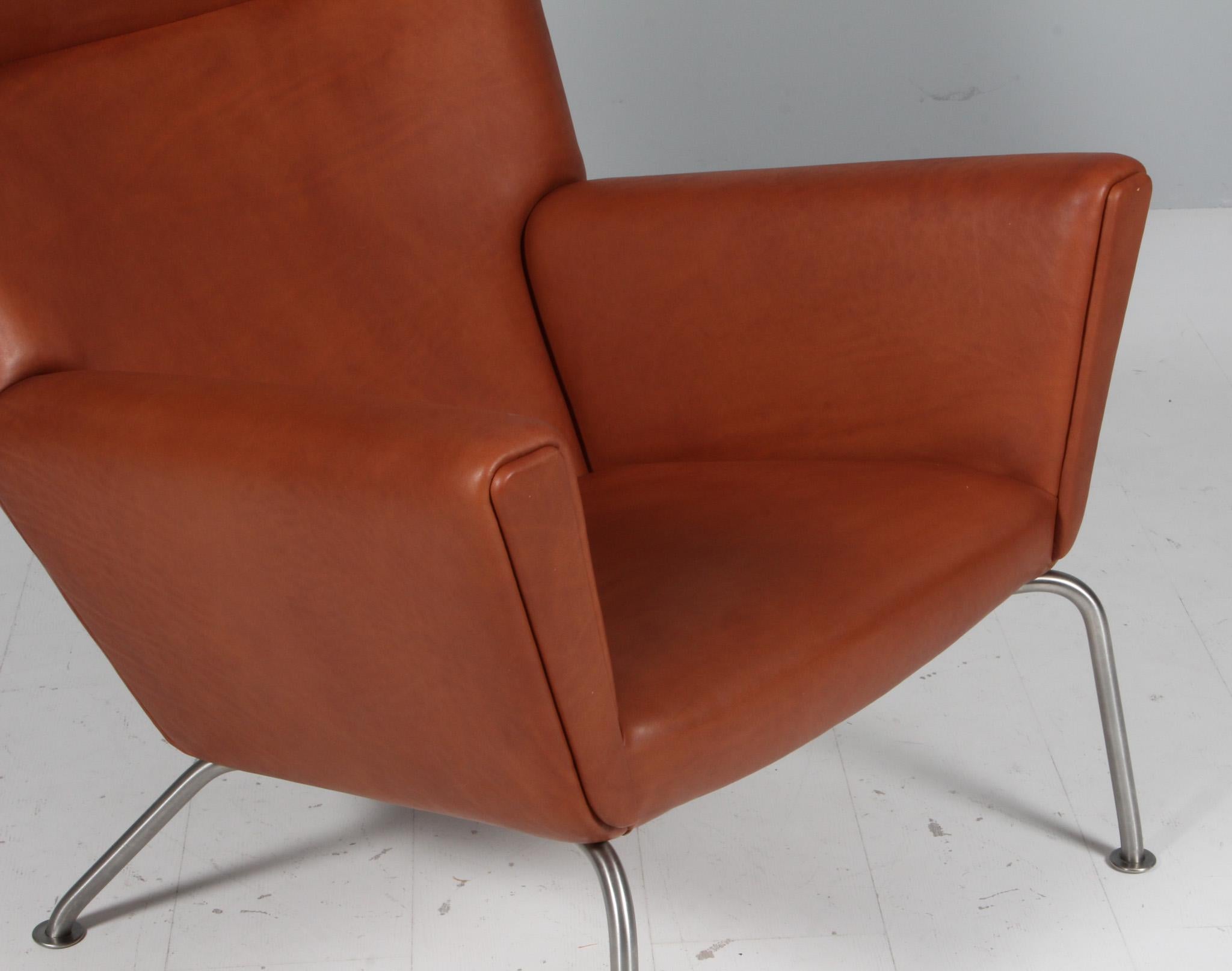 Stainless Steel Hans J. Wegner wing chair and ottoman in full grain leather, model CH445