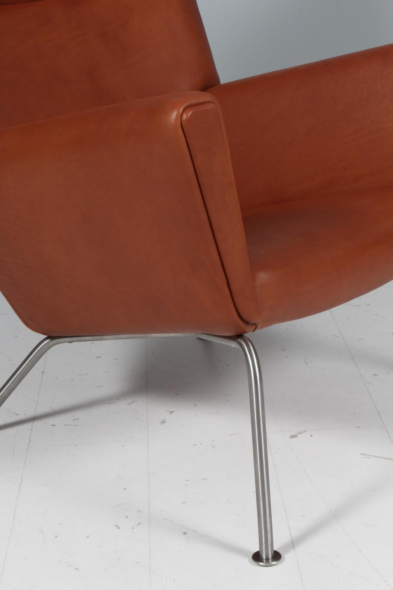 Hans J. Wegner wing chair and ottoman in full grain leather, model CH445 1