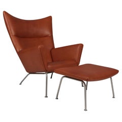Hans J. Wegner wing chair and ottoman in full grain leather, model CH445