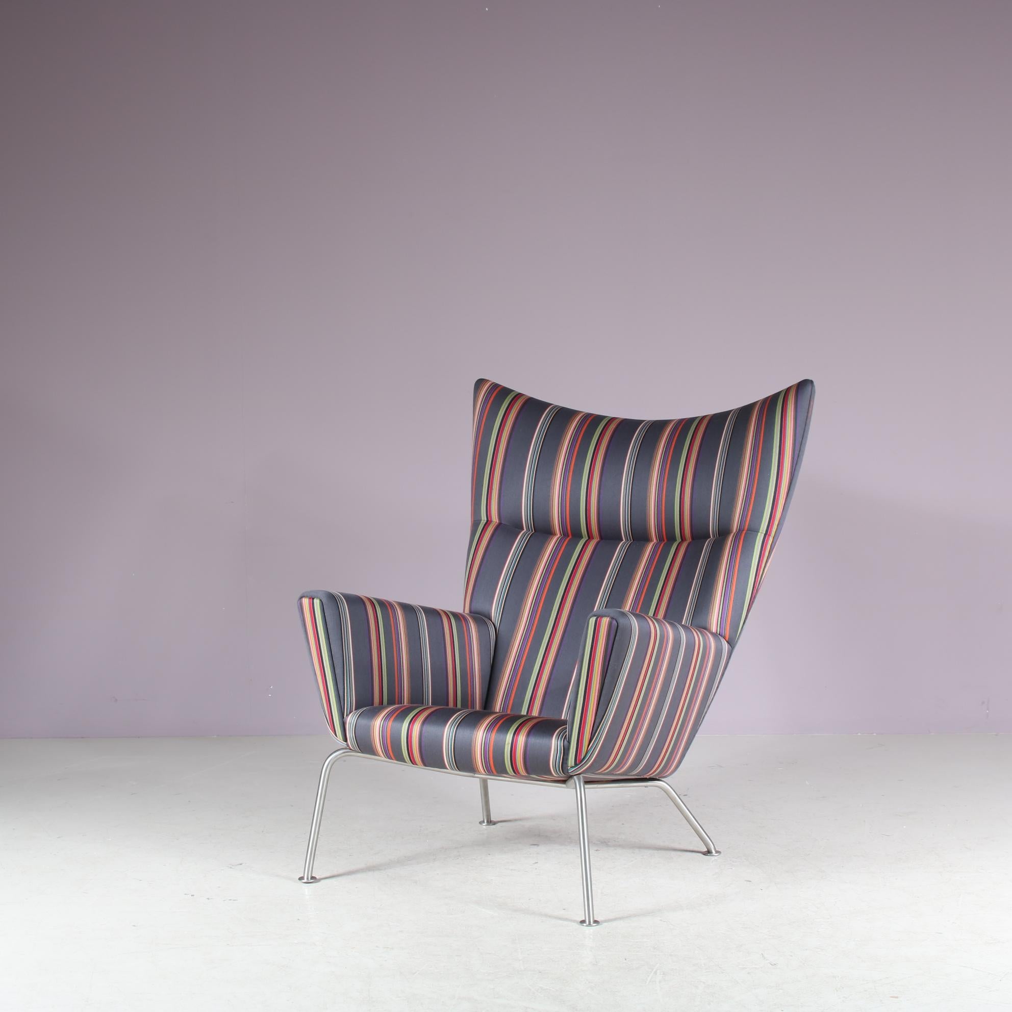 

A highly recognizable “Wing” chair model CH445, designed by Hans J. Wegner and manufactured by Carl Hansen & Son in Denmark around 2000.

This beautiful highback chair, model number CH445, is an impressive find of mid-century design! The original