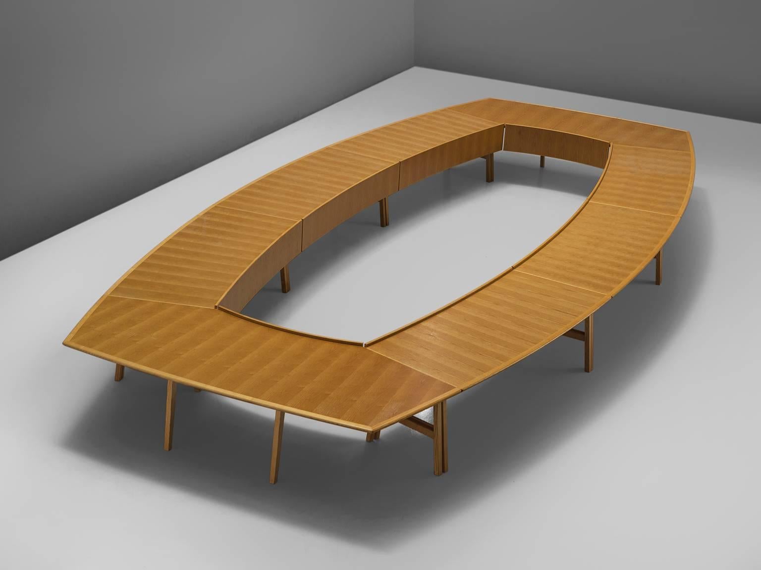 Hans Wegner for PP Møbler, conference table, ash, Denmark, 1970.

This large table was designed by Hans Wegner as a commission. The table is executed in ash and has a cornered oval shape with a large gap in the middle. The top features a pattern