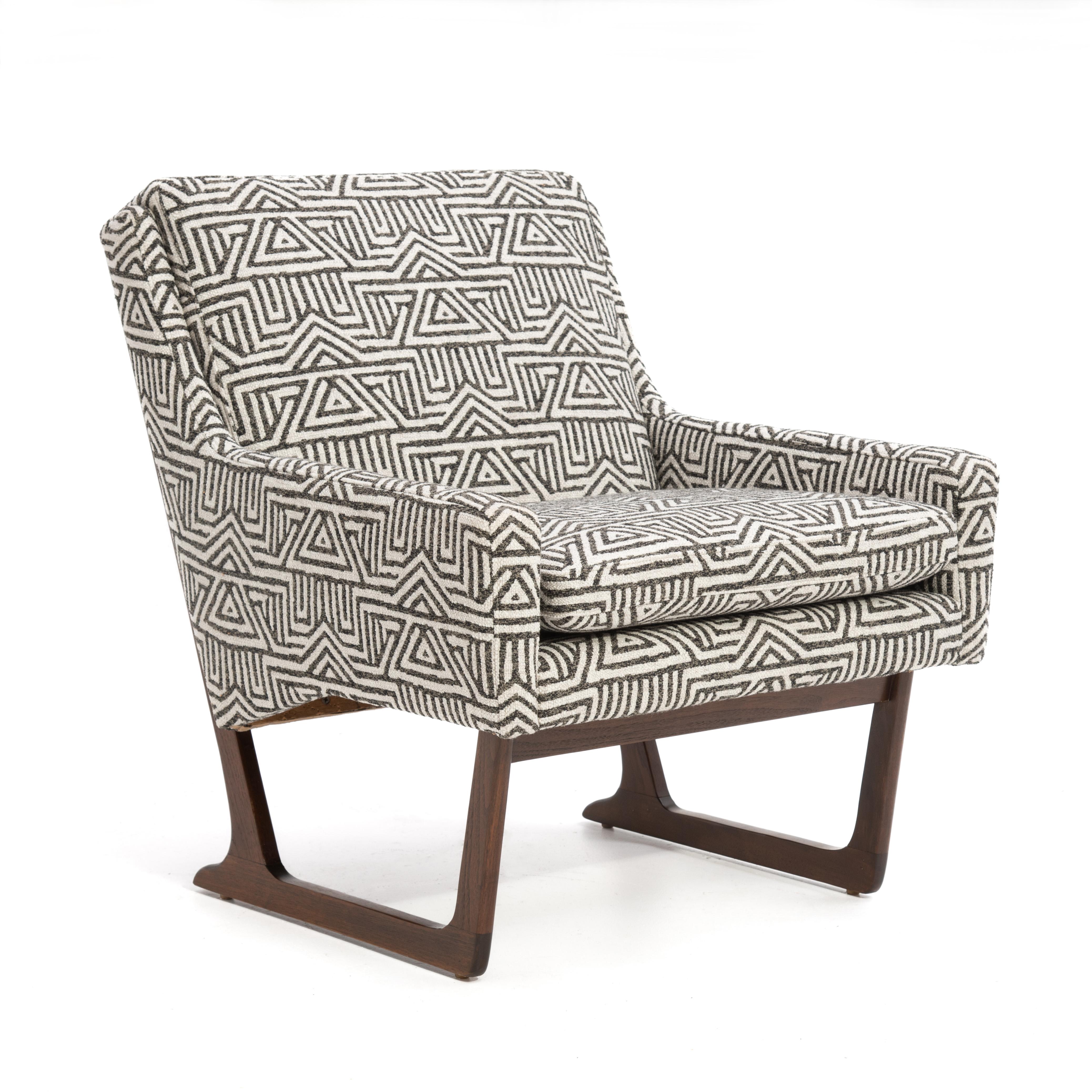 A Mid Century shed or sleigh base lounge chair designed for Deco House by Hans Juergens, often attributed to Greta Talk. Freshly reupholstered in a bold tribal fabric.