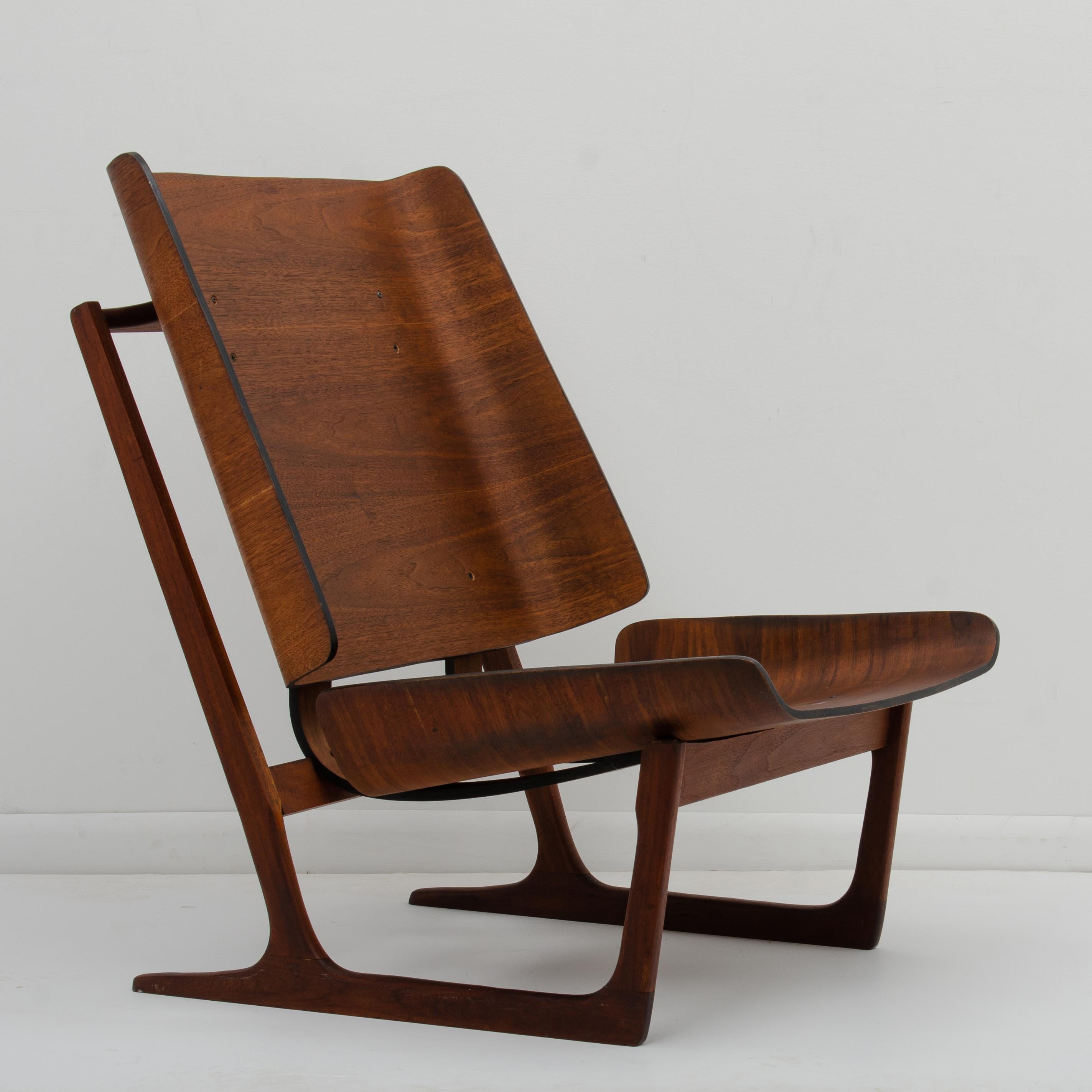 A Mid-Century Modern walnut lounge chair designed by Hans Juergens for Deco House. Often misattributed as teak, designed by Grete Jalk and made in Denmark. This chair is well made, looks great at all angles and was designed with attention to detail.