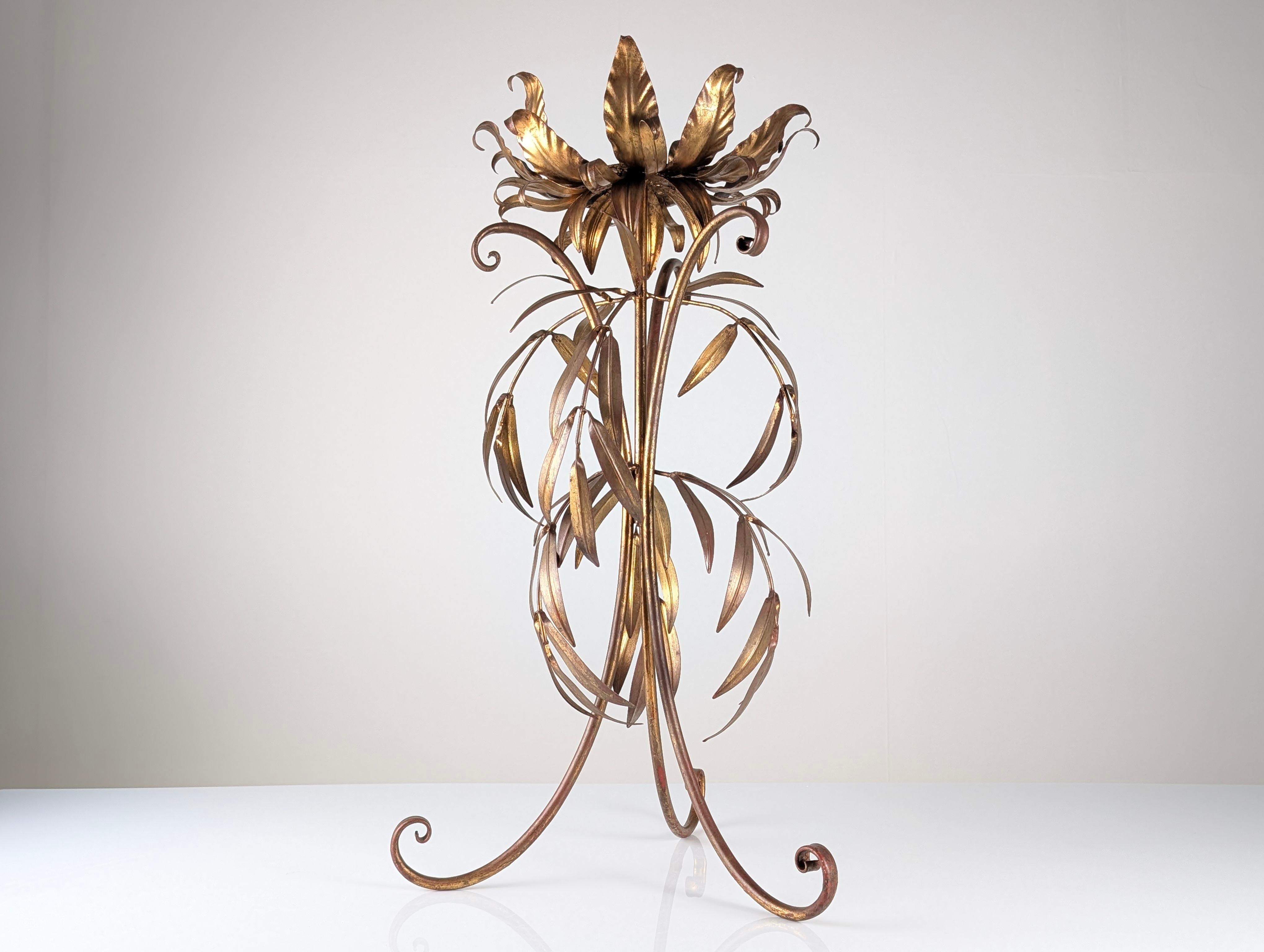 Sculptural standing planter in gilded metal by Hans Kögl, crafted in Germany during the 1970s. This piece features an ornate composition of curved leaves wrapping gracefully around the structure from base to crown. Executed in Kögl’s signature
