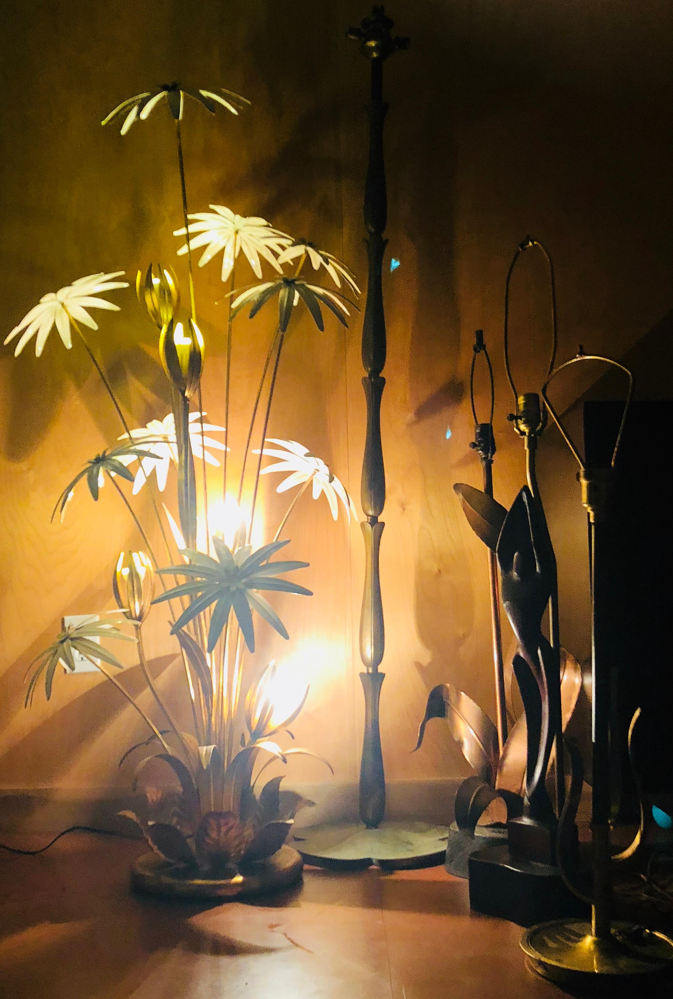 Designed in Germany by Hans Kögl in the 1970s. This gorgeous, rare floor lamp features nine antique whiteblossoms and five gilt buds. Bulbs are installed in those five beautiful gilded floral metal buds. Solid, gilded base. I will include a foot