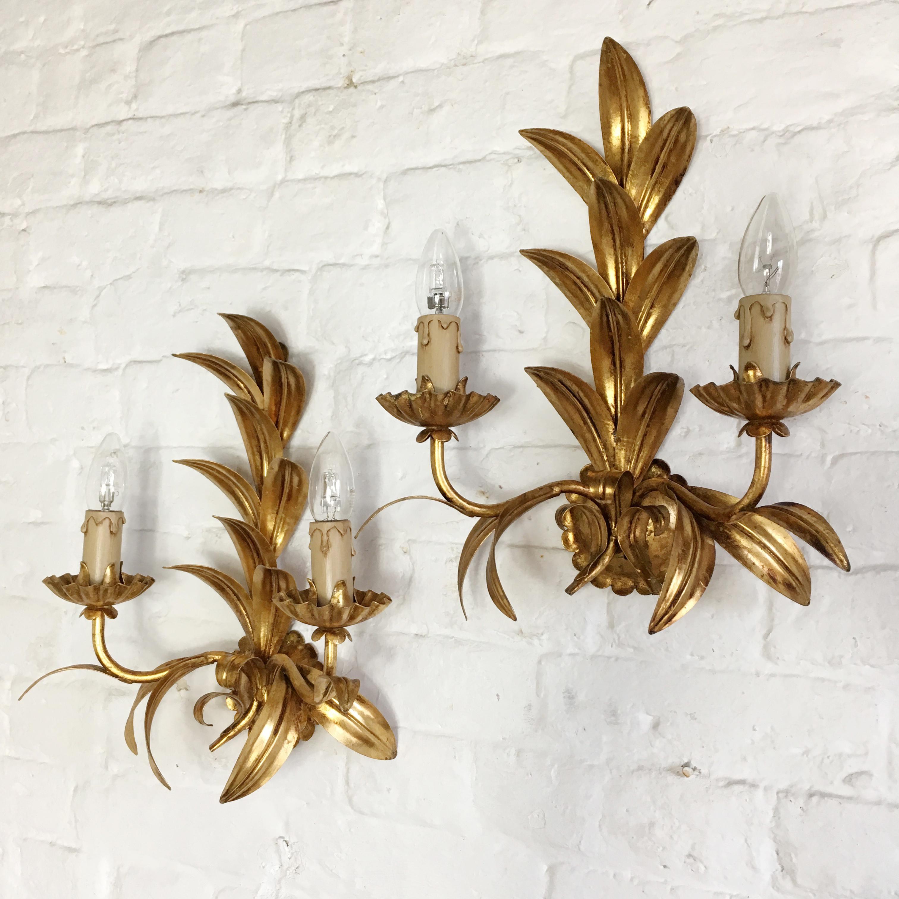 A pair of gilt Hans Kogl leaf wall sconces. Scalloped back plate with beautiful leaf arrangement. The lights are wired and in full working order, but as with all our lighting we would always suggest they are fitted and tested by a qualified