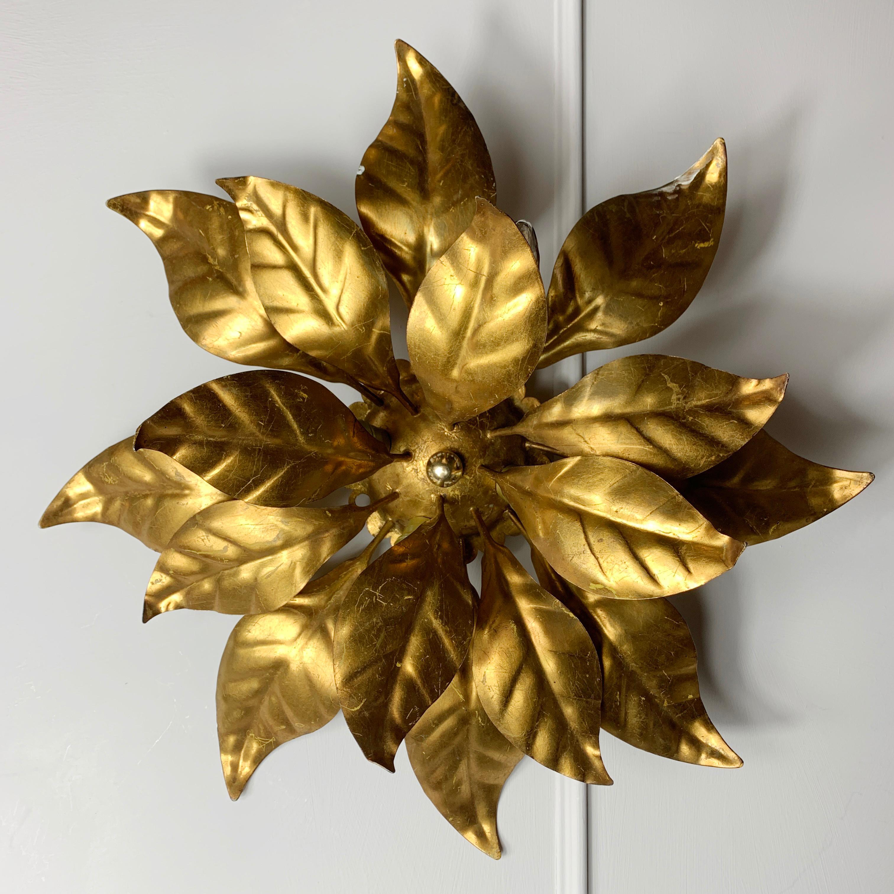 Hans Kogl leaf flush ceiling light 1970's
Rosette made from multiple gilt leaves scalloped central rose
Original gold leaf finish

Measures: 44cm width, 15cm depth, rose 12cm width
The light has 4 bulb holders, E14

Some gilt loss with age and