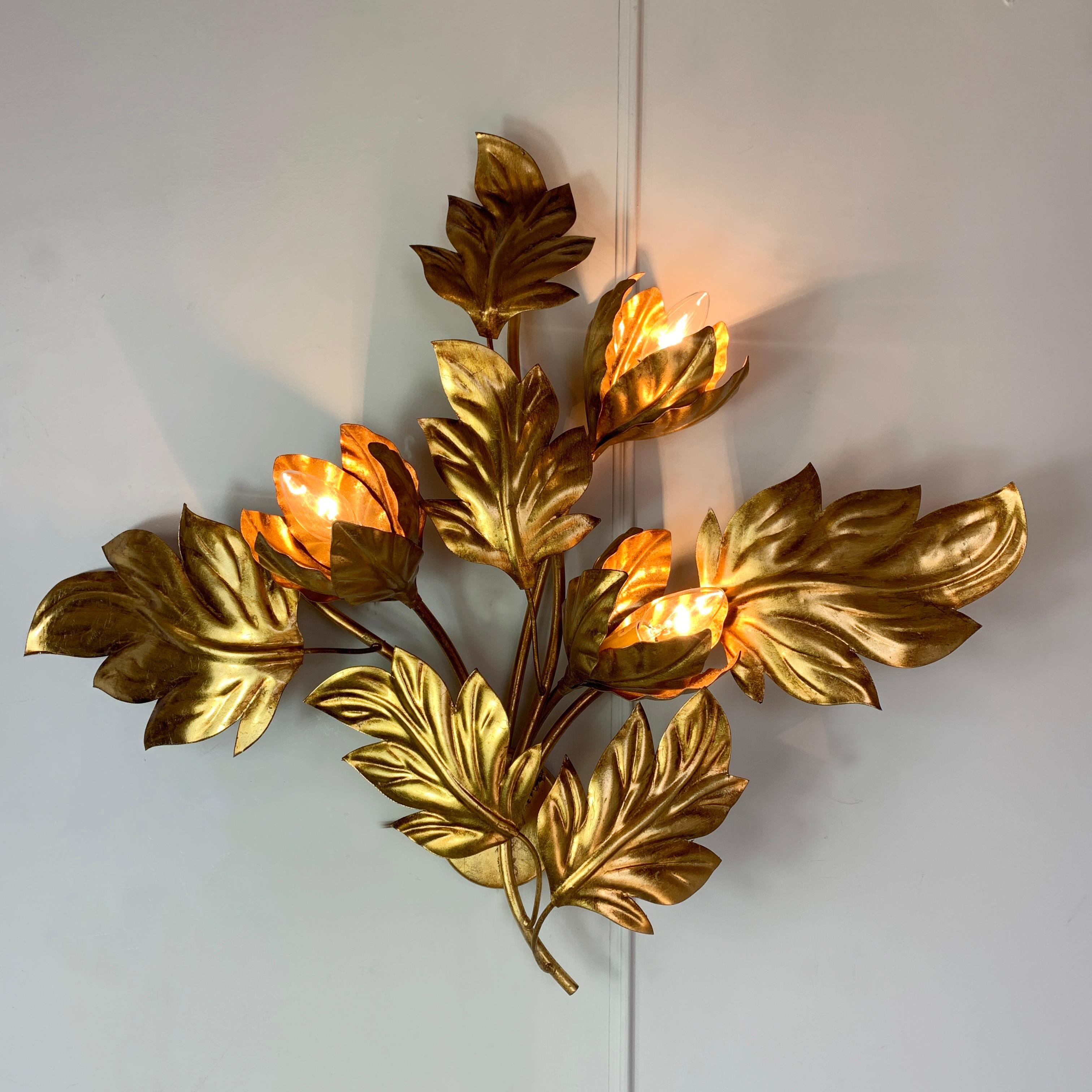 A beautiful 1970s' Hans Kogl wall light, large gilt leaves surround the three flower buds that house the lamp holders. This is a rare Hans Kogl design, and is in excellent vintage condition, fully rewired and pat tested.

Dimensions: 75cm width x