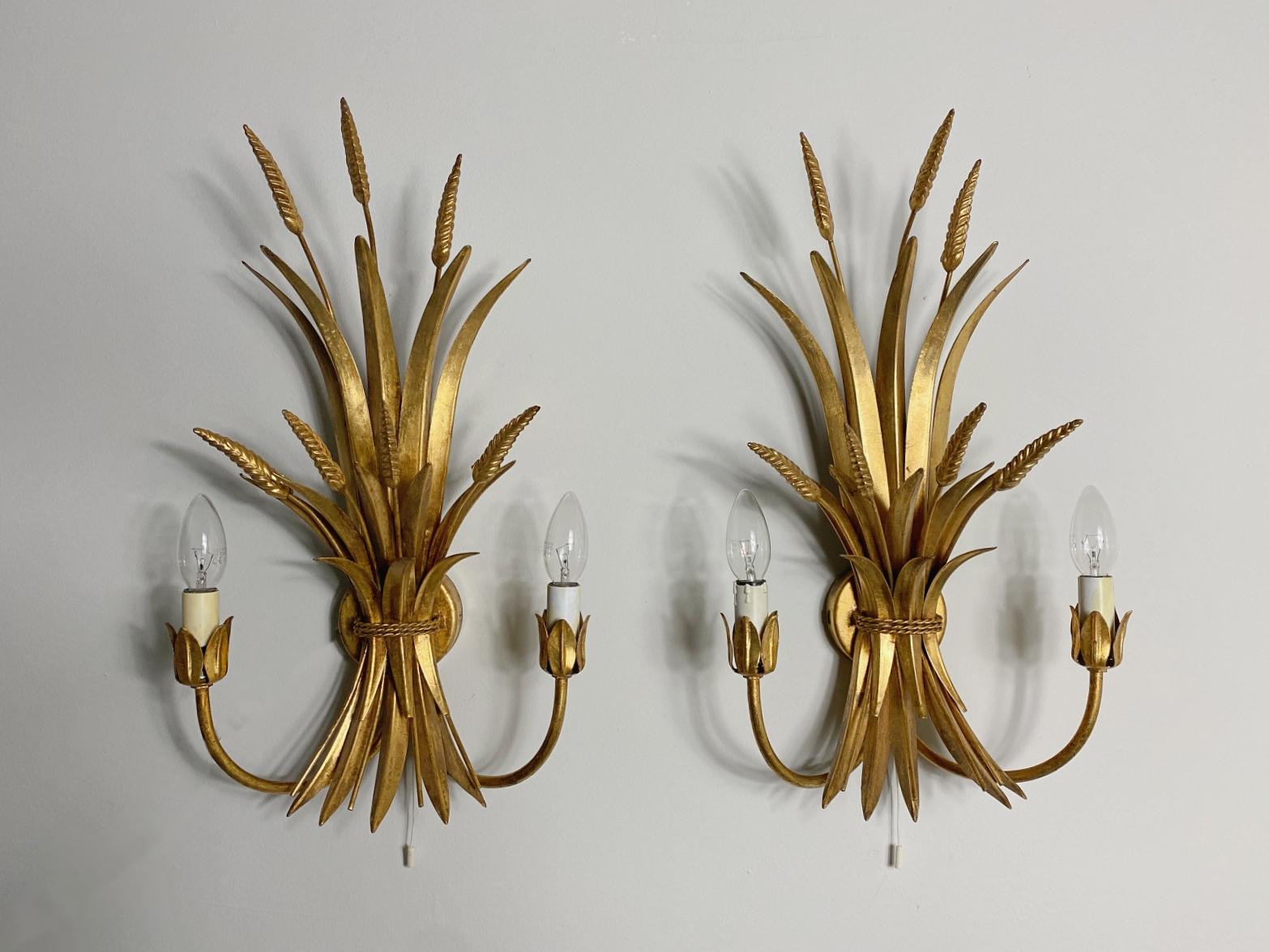 Beautiful wall lights manufactured & designed by HANS KÖGL in 1970s. Featuring a gilded brass base.
Fully working and tested condition with two E14 Edison socket, the lamp work on 220V and 110V. 

