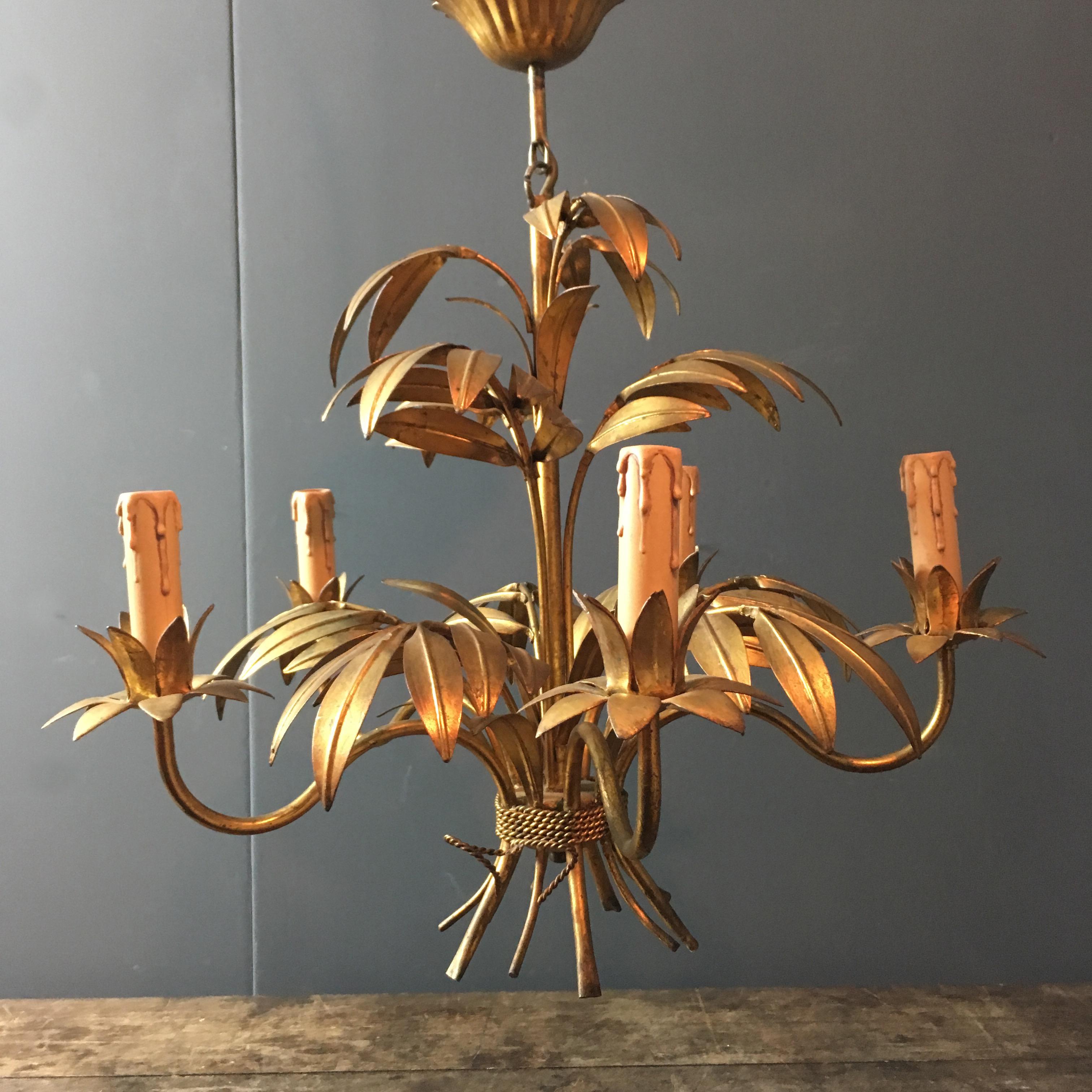 Hans Kögl palm leaf chandelier.

Beautiful gilt leaves forming a full main stem with arms reaching out to each bulb holder

The light has 5 bulb holders taking E14 screw in bulbs

German

Stunning piece,

circa 1970s.

Measures: 48 cm
