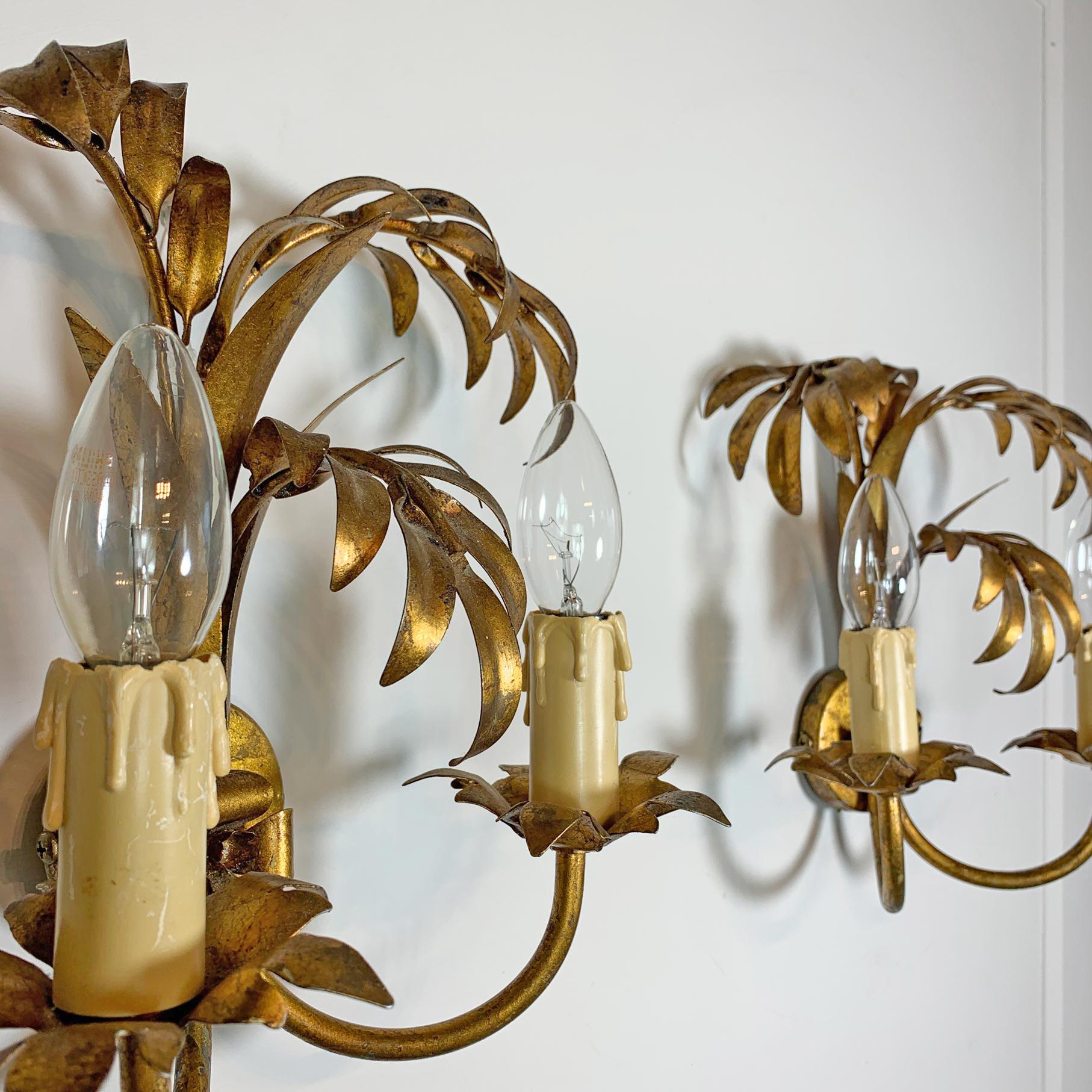 A beautiful pair of gilt metal wall lights, designed by Hans Kogl in the form of palm leaves, each light has two e14 (small screw in) lamp holders, dating to the 1970’s.

Height 28cm x Width 28cm x Depth 18cm
Back Plate is 7.5cm across 
