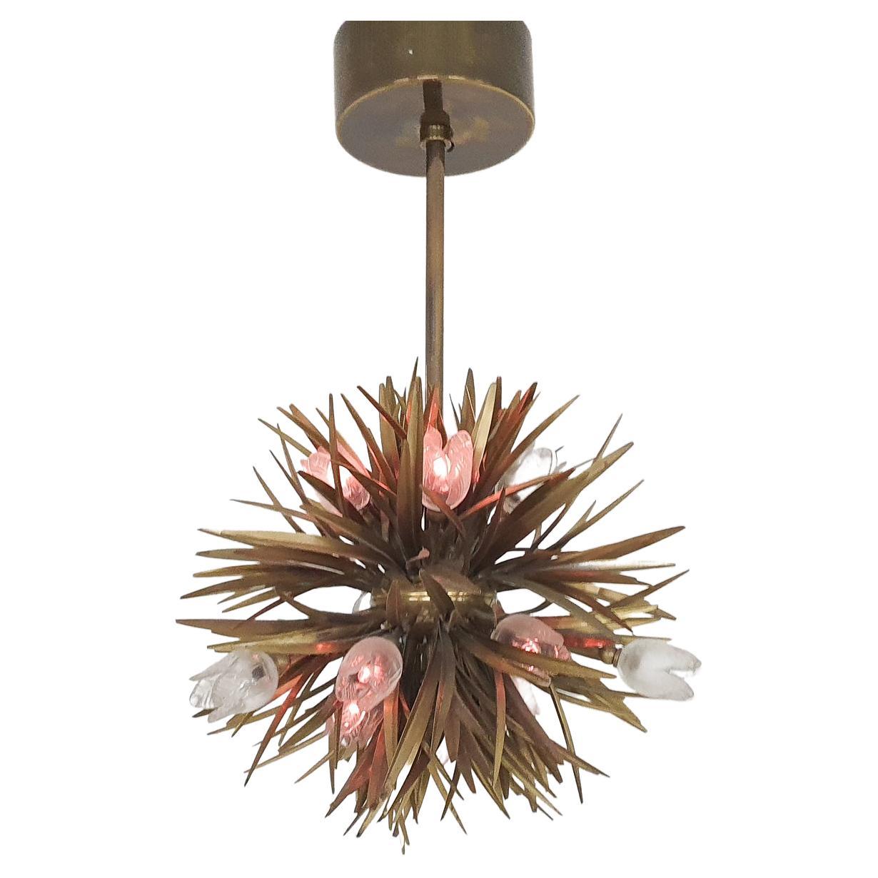 Brass florentine chandelier with glass flower details.