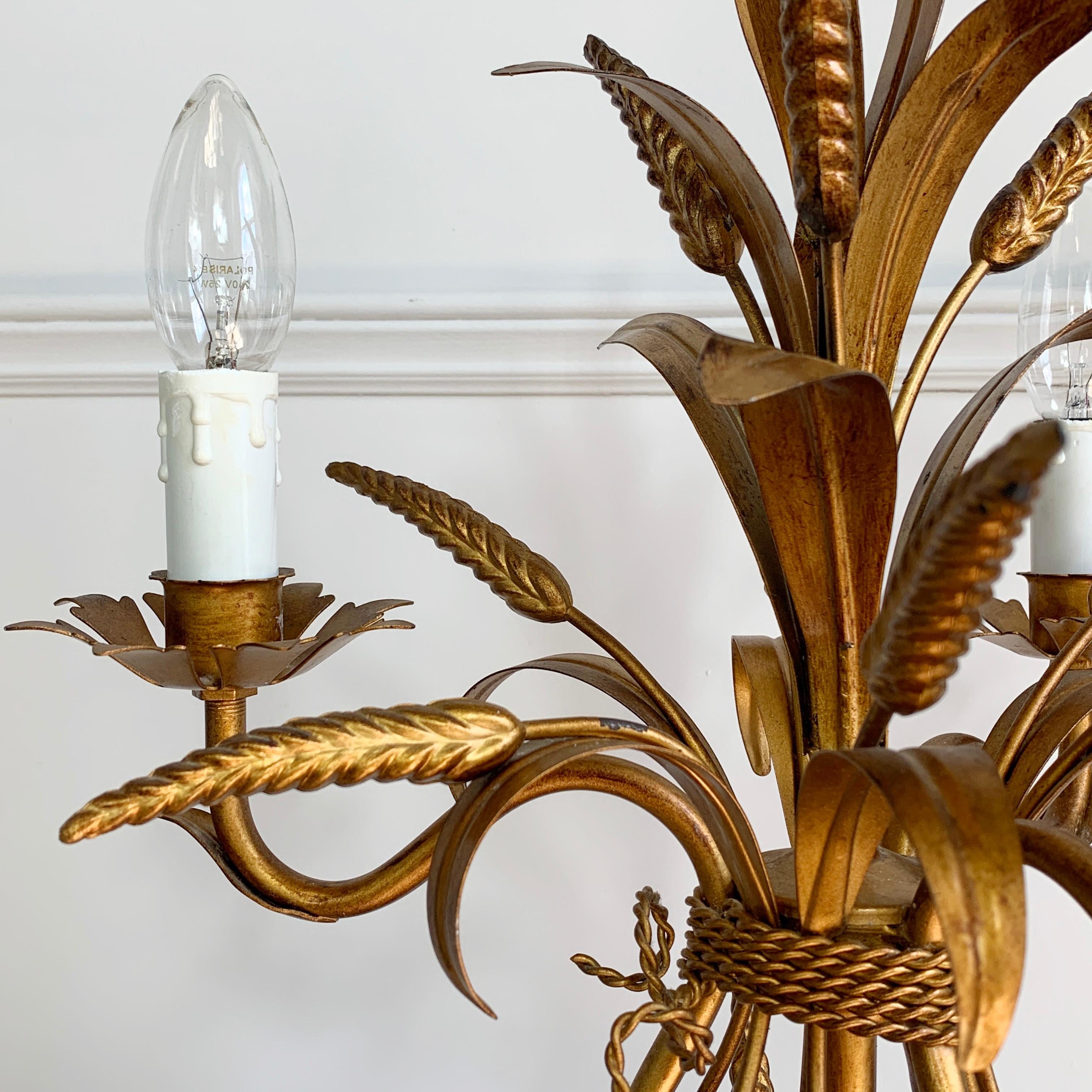 Hans Kögl wheat sheaf table lamp, circa 1970s
Statement Wheatsheaf and gilt leaf lamp by Hans Kögl
65cm height, 35cm width, base 19cm width
The lead has an inline switch for ease of use
3 lampholders with faux candle covers, e14 lamp