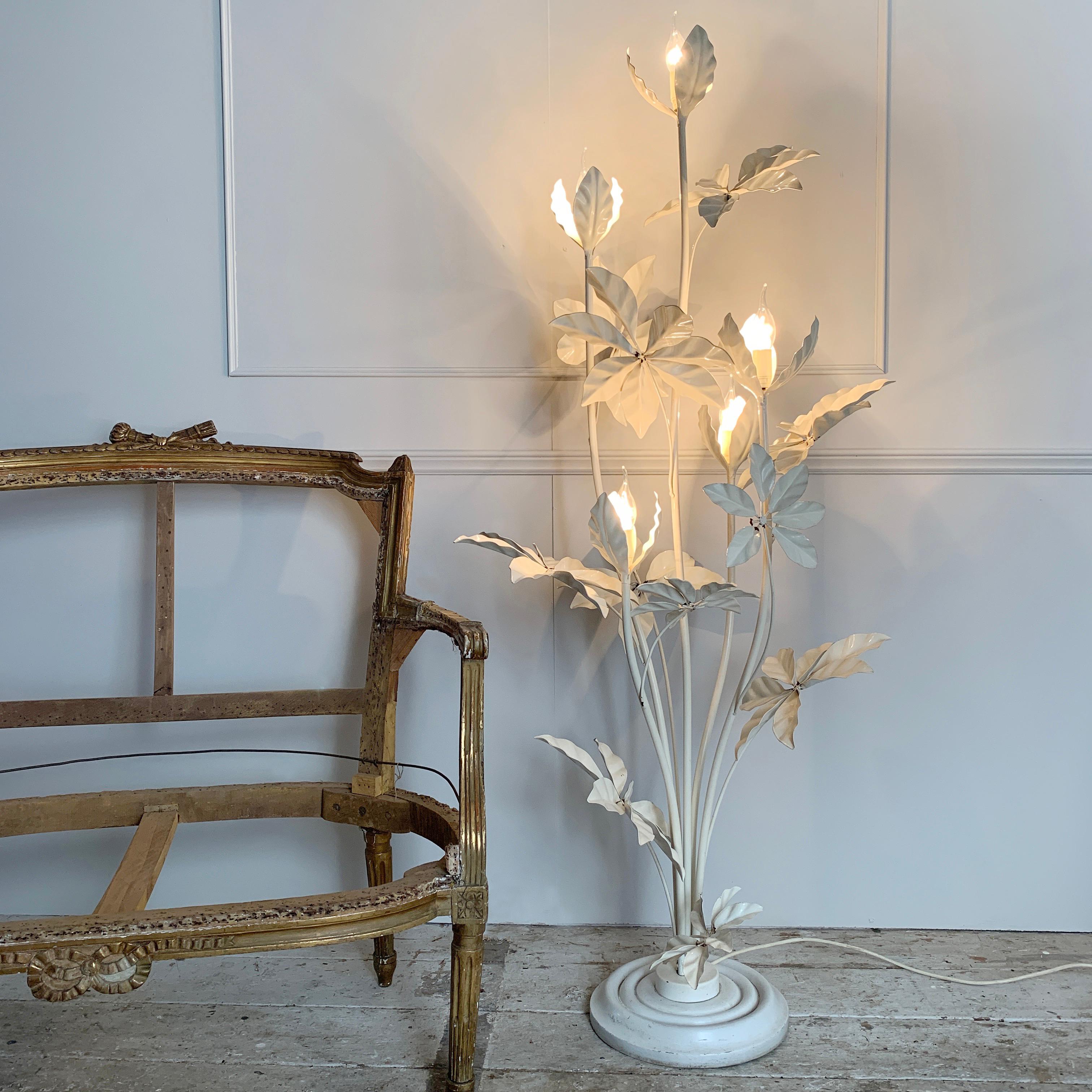Midcentury soft white tole floor lamp
Hans kögl, germany, 1970s stunning large statement floor lamp
The light as five tall stems each with a bud and bulb holder at the top, the stems are flanked smaller stems and large leaves
Original white paint