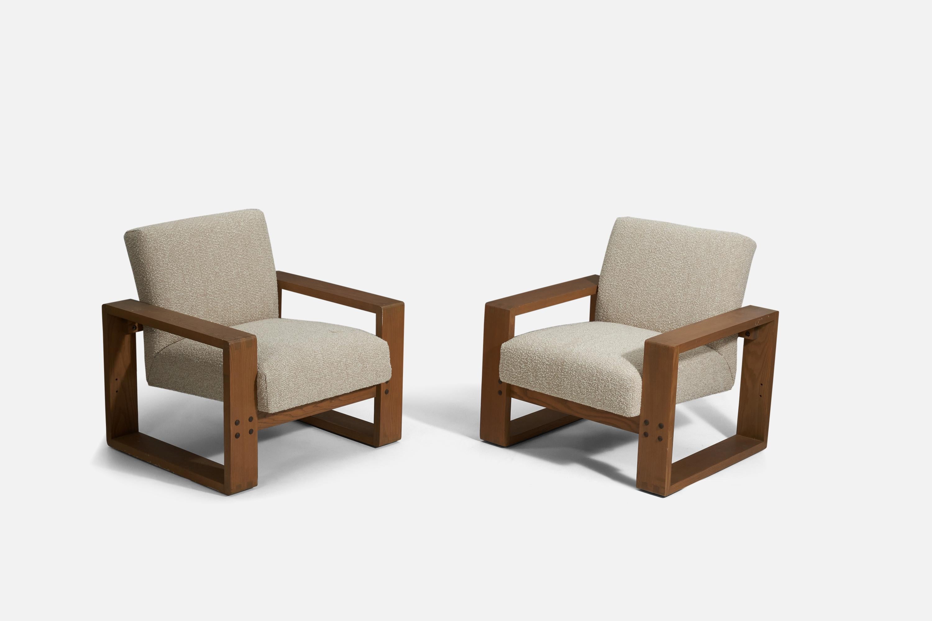 A pair of oak and fabric lounge chairs, produced by Hans Krieks, Boston, Massachusetts, c. 1975.