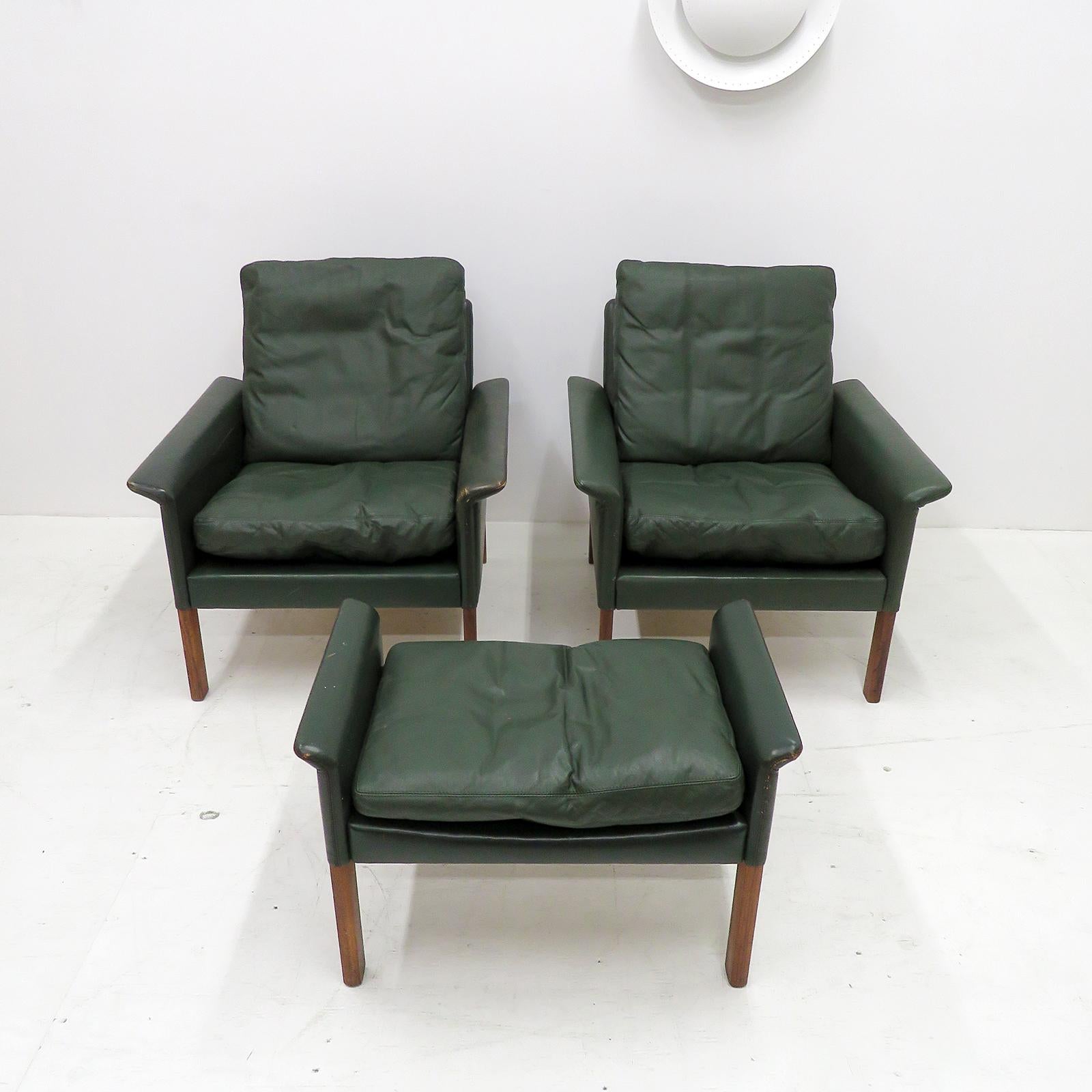 pair of stunning green leather armchairs and ottoman by Hans Olsen, fluted arms upholstered in leather, original soft leather upholstery with loose feather down cushions on rosewood legs. 

Priced as a set.