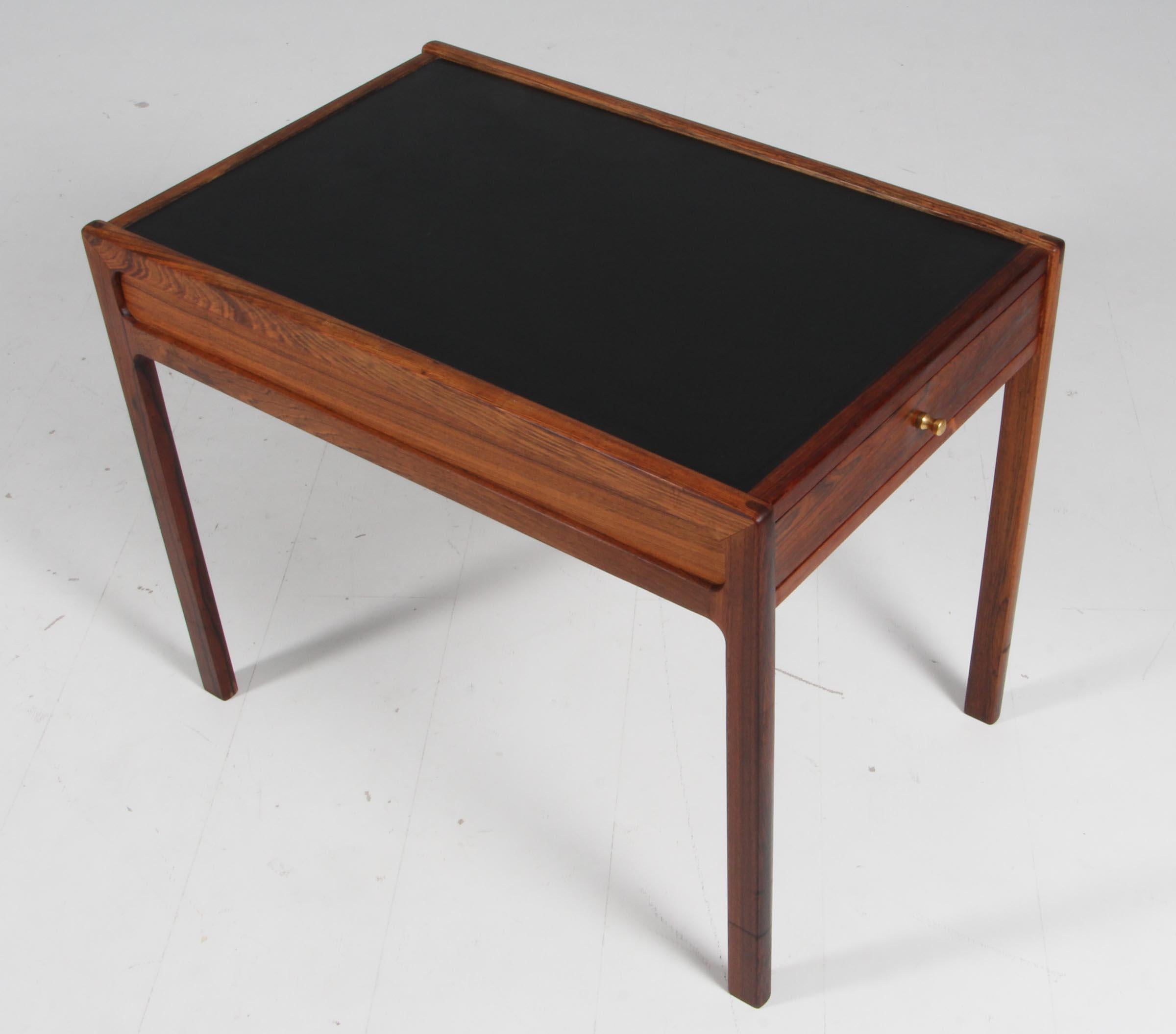 Hans Olsen coffee table / side table of rosewood and leather with drawers with brass handle.
