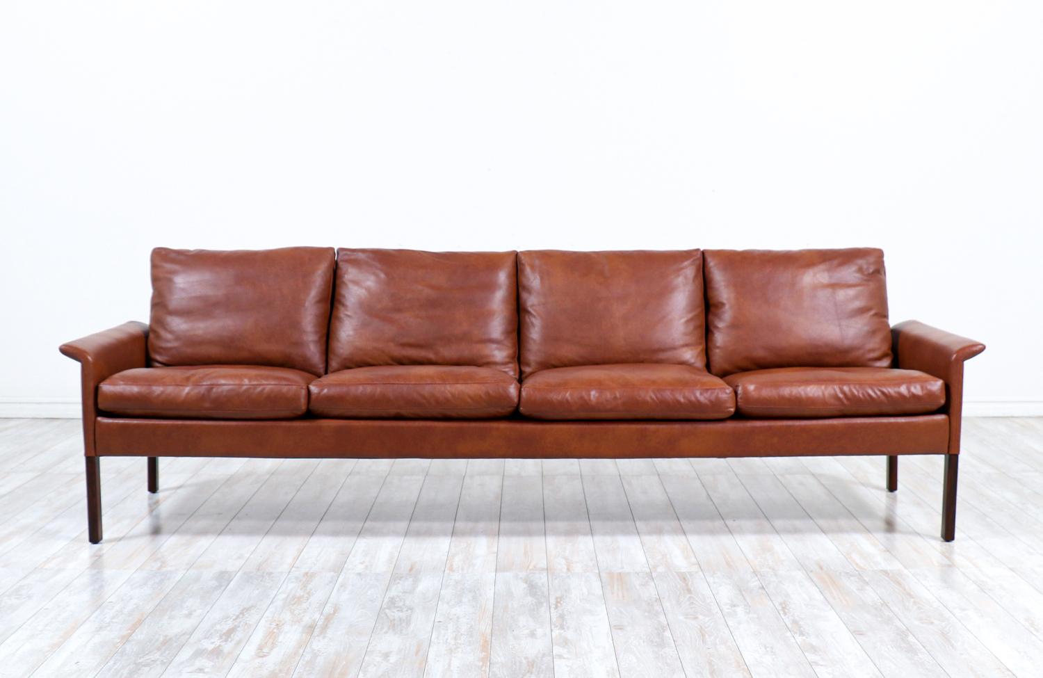 Hans Olsen Cognac leather & rosewood 4-seater sofa for CS Møbelfabrik.