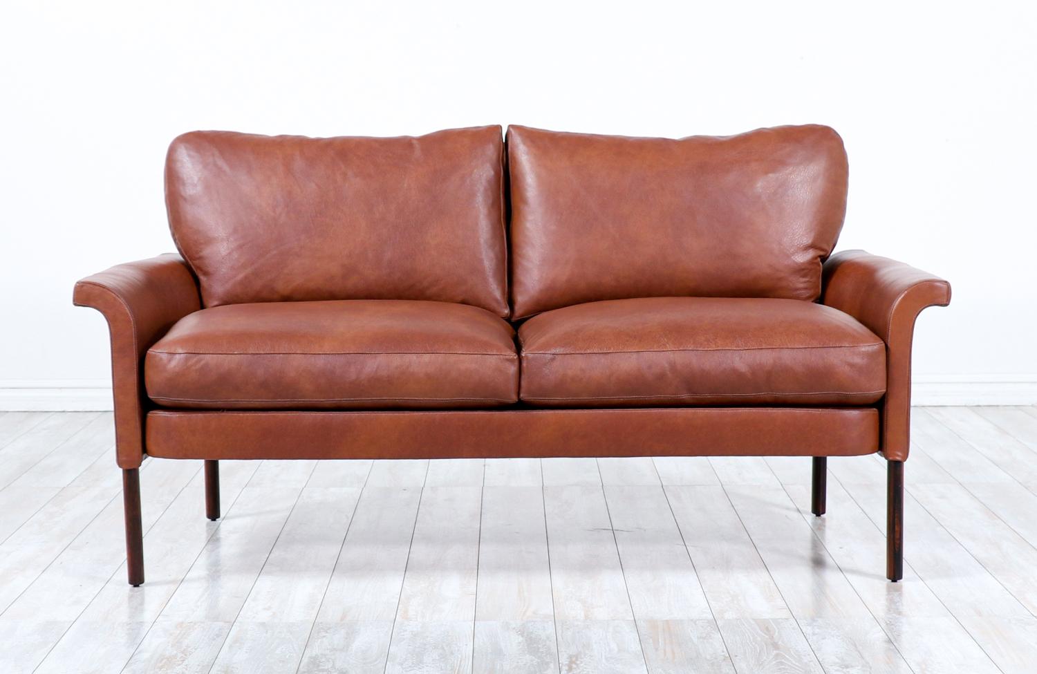 Hans Olsen Cognac leather & rosewood love seat sofa.