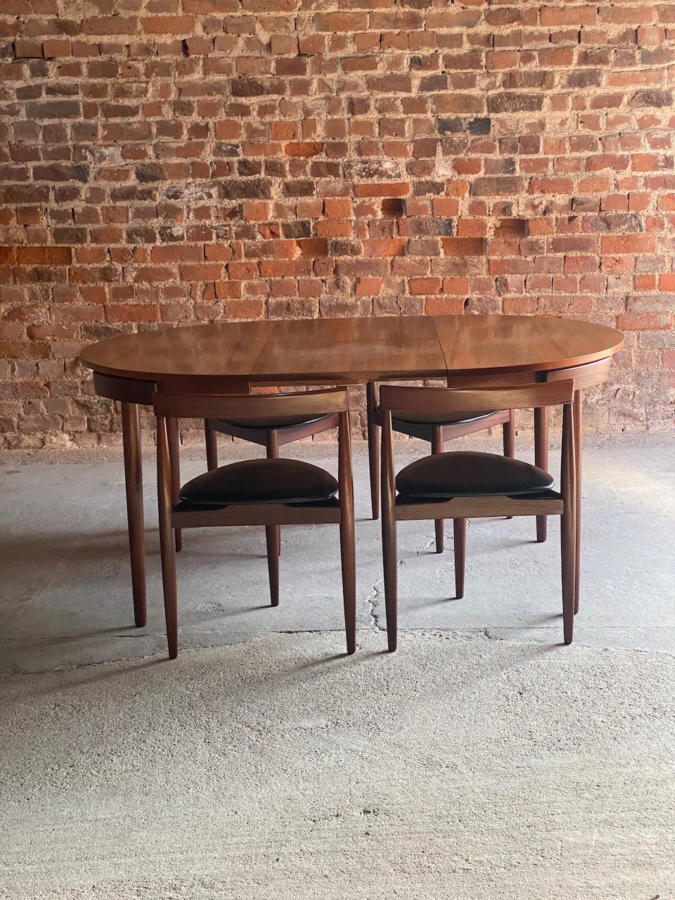 Hans Olsen Dinette dining table and four chairs Frem Rojle Circa 1960

Magnificent mid century Danish Hans Olsen designed 'Dinette' extending dining table manufactured by Frem Rojle Denmark circa 1960. The table is made from solid teak and
