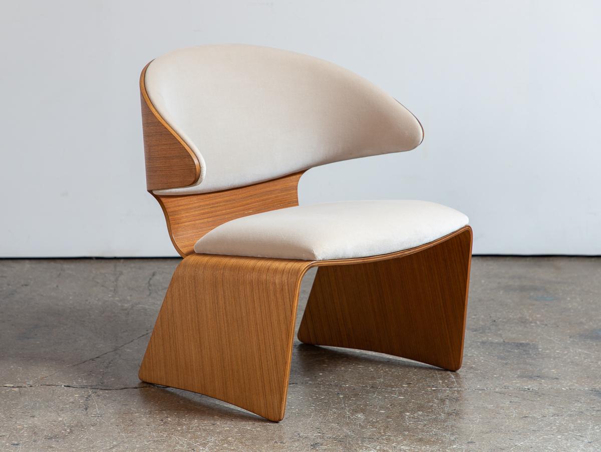 Sleek Bikini Chair in camel velvet, designed by Hans Olsen for Frem Rojle. Traditional Danish craftsmanship is reimagined in this innovative design with a nod toward futuristic curves of Space Age designs. Gleaming teak bent plywood frame is in