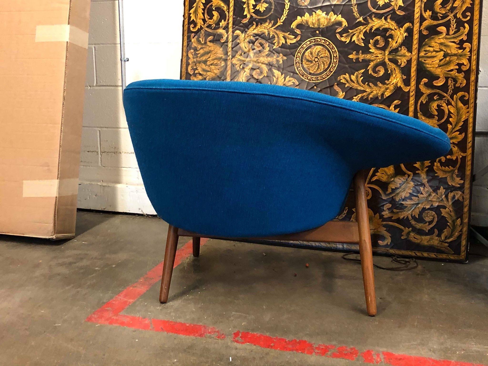 Early example of the Hans Olsen “Fried Egg” chair in teak and original blue tweed produced by Bramin-Denmark circa 1956.
Original upholstery and cushioning present and shows ware consistent with age. Foam is deteriorating and fabric is faded.