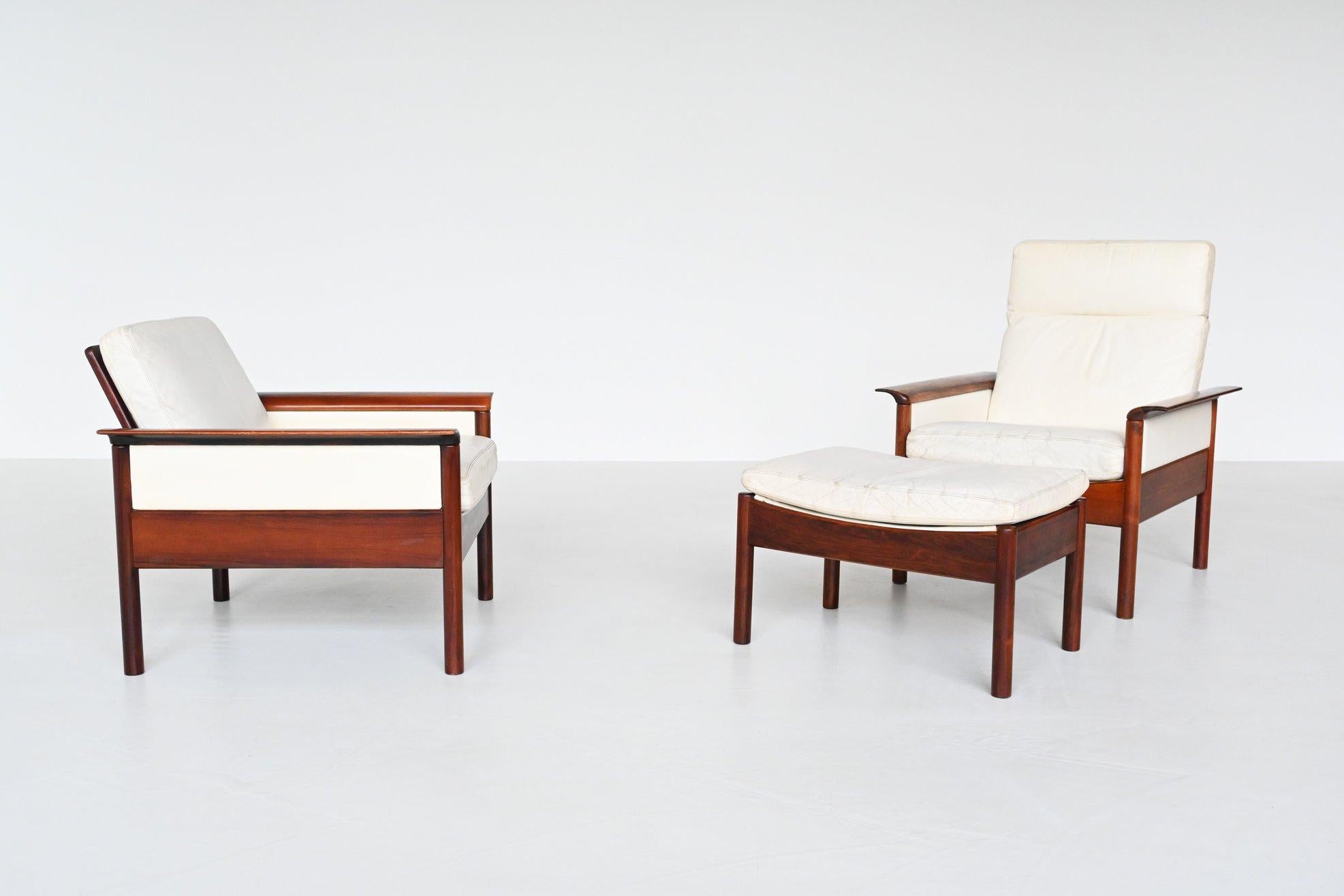 Beautiful pair of lounge chairs designed by Hans Olsen for Vatne Mobler, Denmark 1960. These chairs and ottoman have nicely grained solid rosewood frames and white leather cushions. They are nice shaped with rolled winged arms. The chairs are in