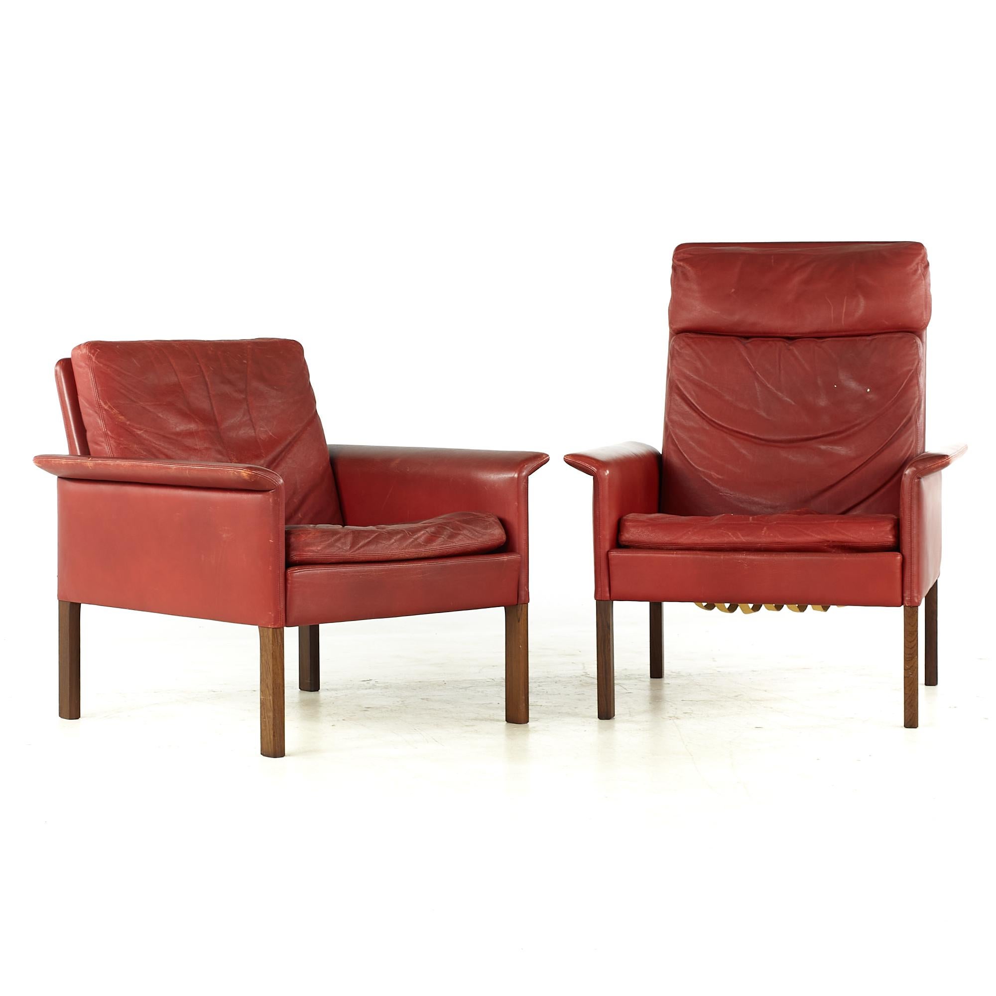 Hans Olsen midcentury Danish Rosewood and Red Leather Chairs - Pair

The His chair measures: 29.5 wide x 28 deep x 38 inches high
The Hers chair measures: 29.5 wide x 28 deep x 29 inches high
Both chairs have a seat height of 16 and an arm