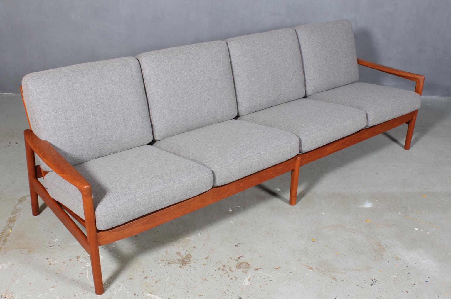 Hans Olsen four-seat sofa with new upholstered epeda cushions with grey 100 % New Zealand divina wool upholstery.

Frame of solid teak. 

Model 563/4.