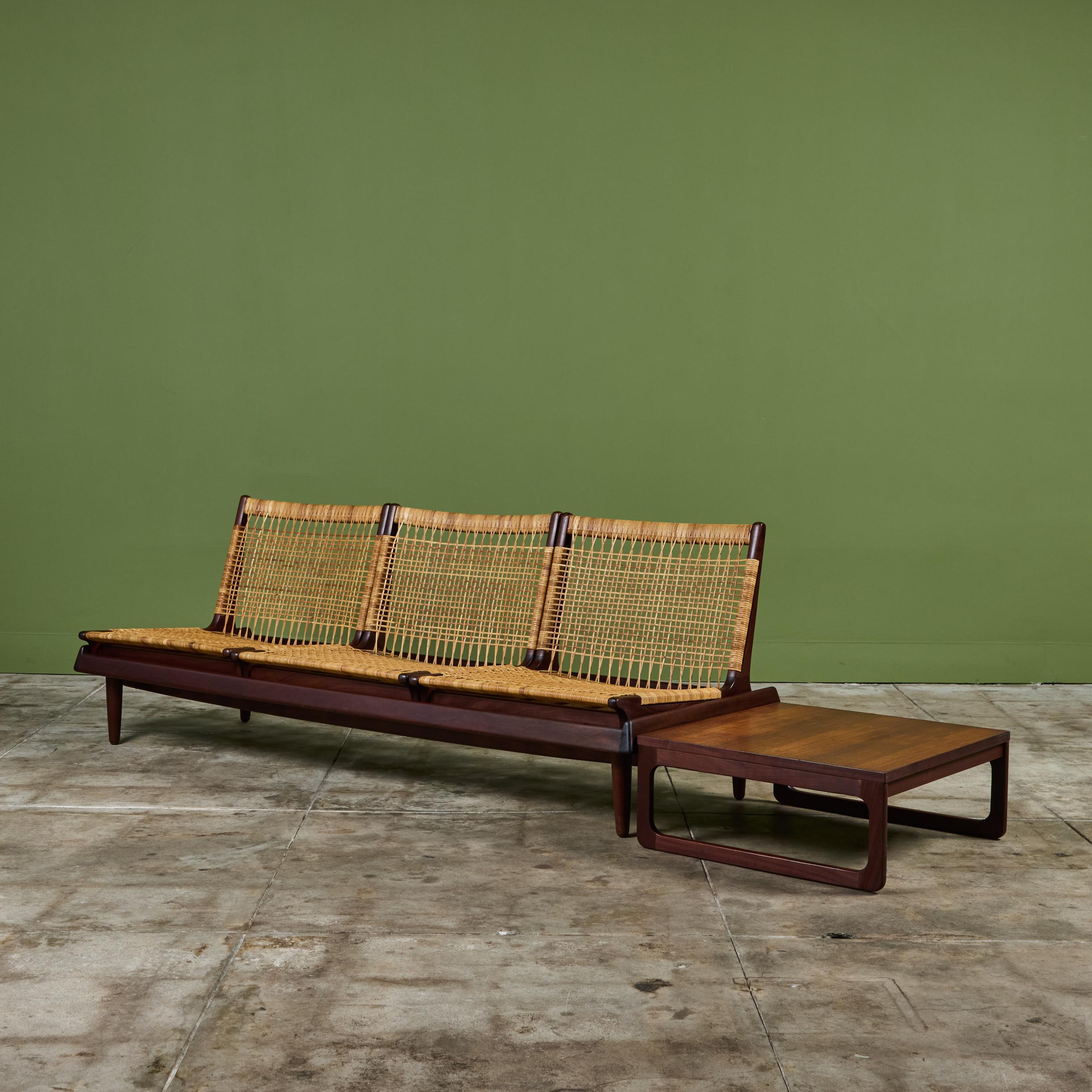 Minimalist three seater sofa, model 161, by Danish designer Hans Olsen for Bramin, c.1950s Denmark. The afromosia wood slatted base supports three removable caned seats that can rearranged on the base or used individually. The sofa also showcases a