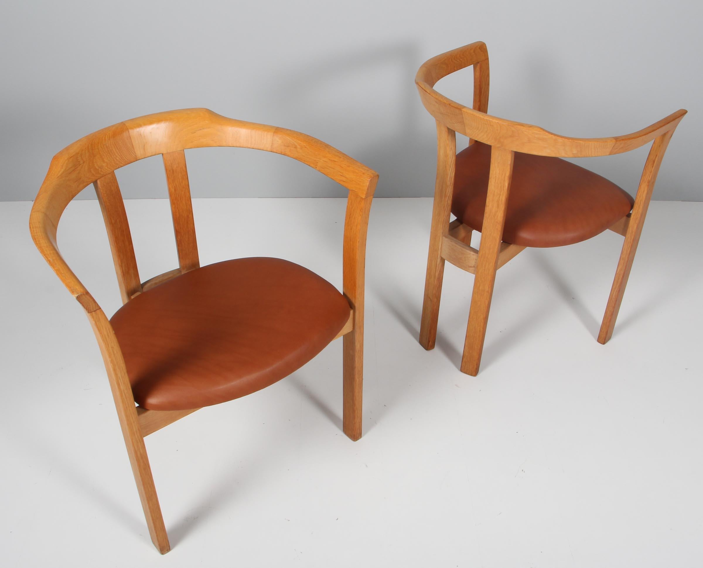 Hans Olsen armchair with frame of solid oak.

Seat new upholstered with cognac aniline leather.

Made by C. S. Møbler.