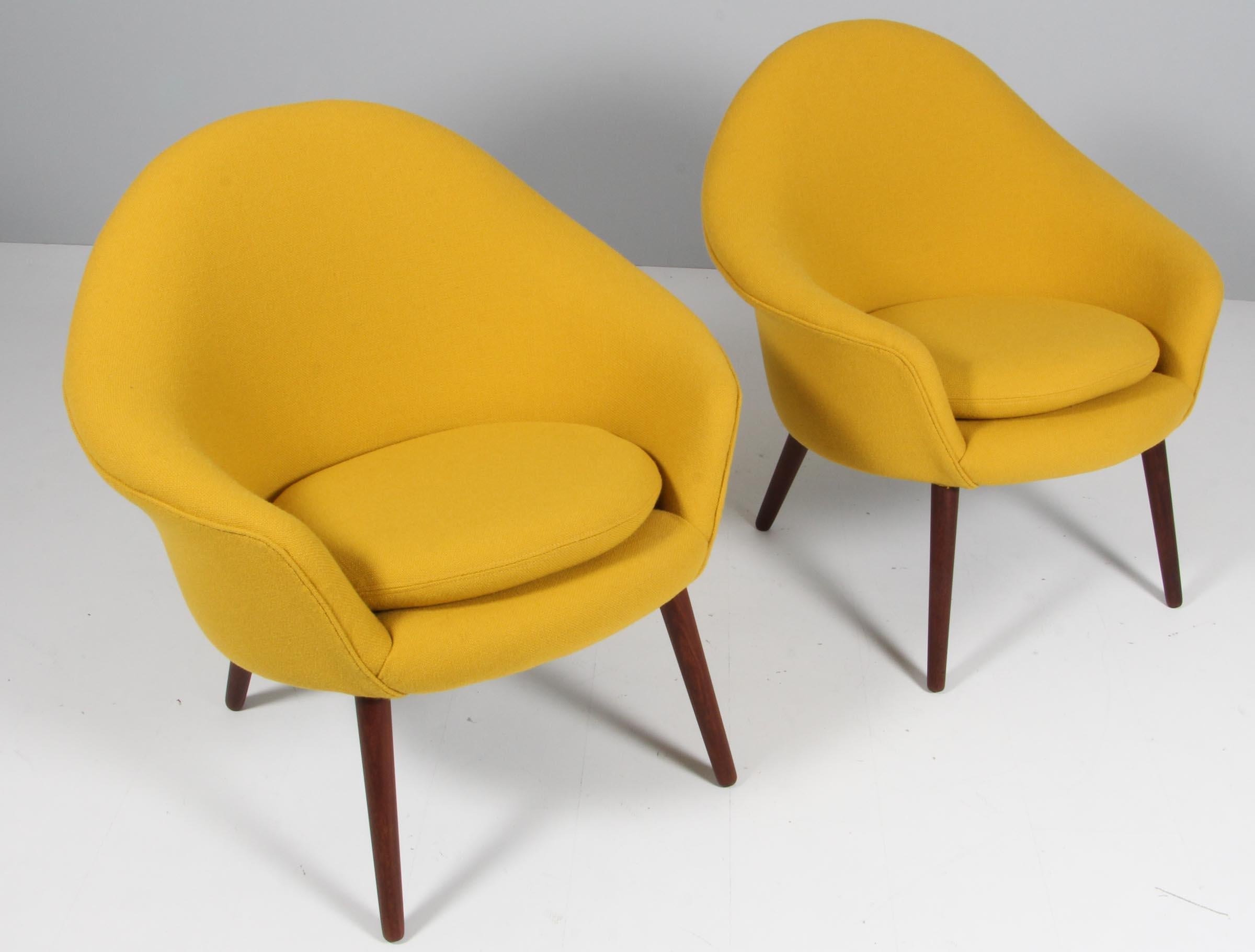 Hans Olsen. Pair of lounge chairs new upholstered with yellow Hallingdal from Kvadrat.

Legs of teak.

Made in the 1960s.

Made by Jørgensen Møbelfabrik, model 187 Cantharel chair.

