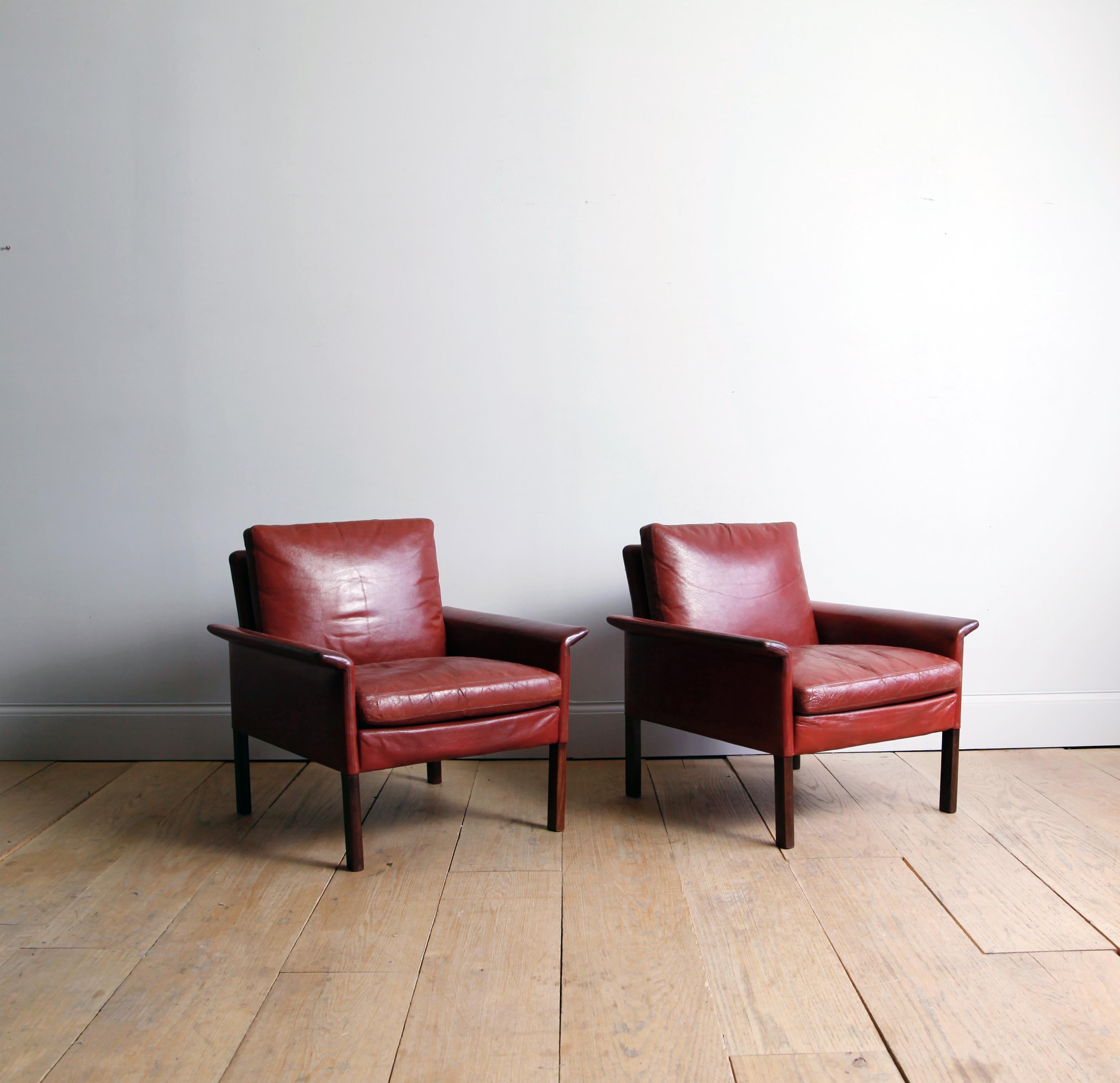 A cabinet maker by training, the Danish Hans Olsen studied at age 30 with the great architect-designer Kaare Klint. He was interested in innovative materials, and comfortable design.

A pair of rosewood armchairs in their original oxblood leather