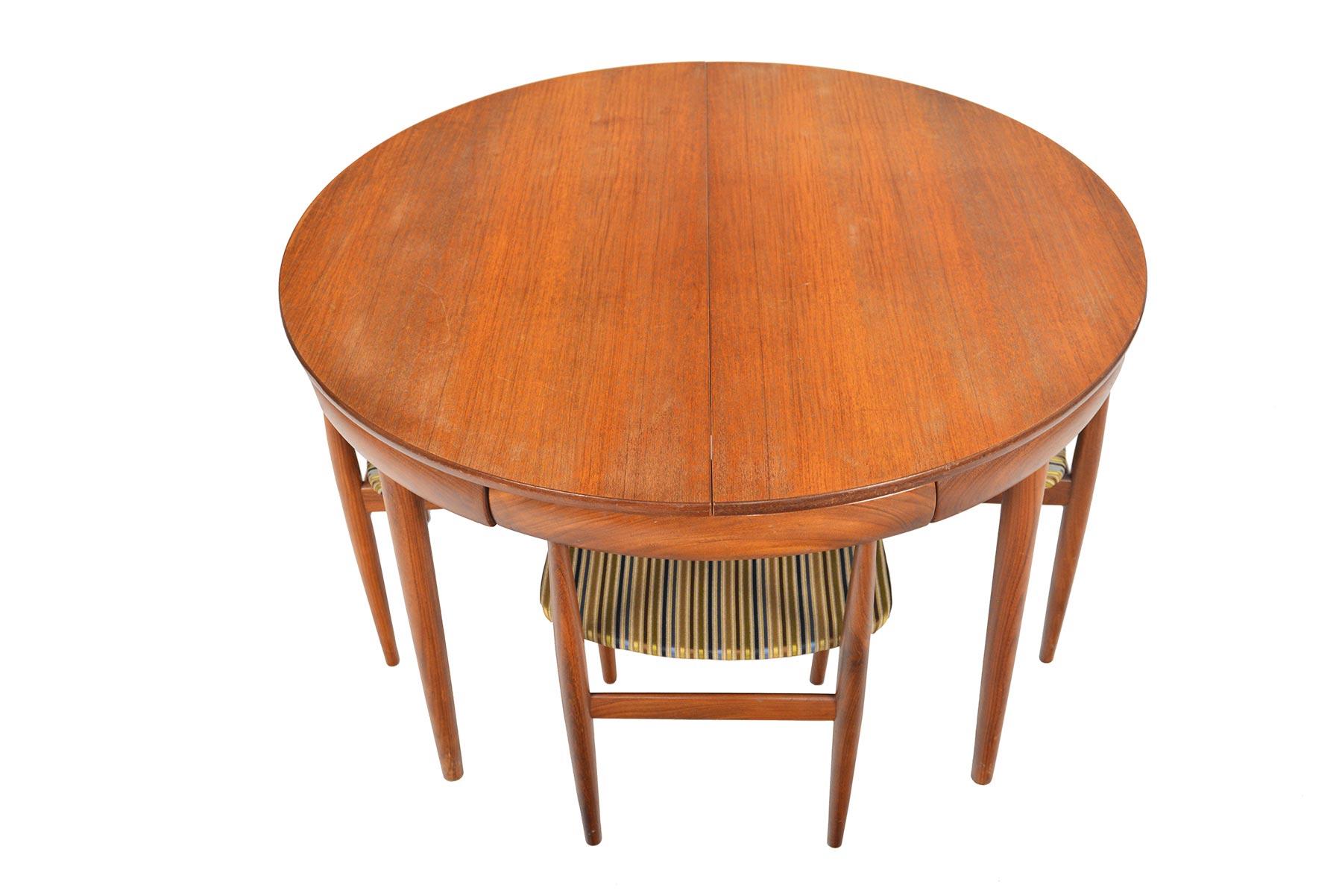 Origin: Denmark
Designer: Hans Olsen
Manufacturer: Frem Rojle
Era: 1960s
Dimensions: 47 diameter x 29.5 tall 
Expanded: 67 long x 47 deep x 29.5 tall
Chairs: 19 wide x 17 deep x 28 tall
Seat: 18 wide x 16 deep x 17.5 tall 

Condition: Table