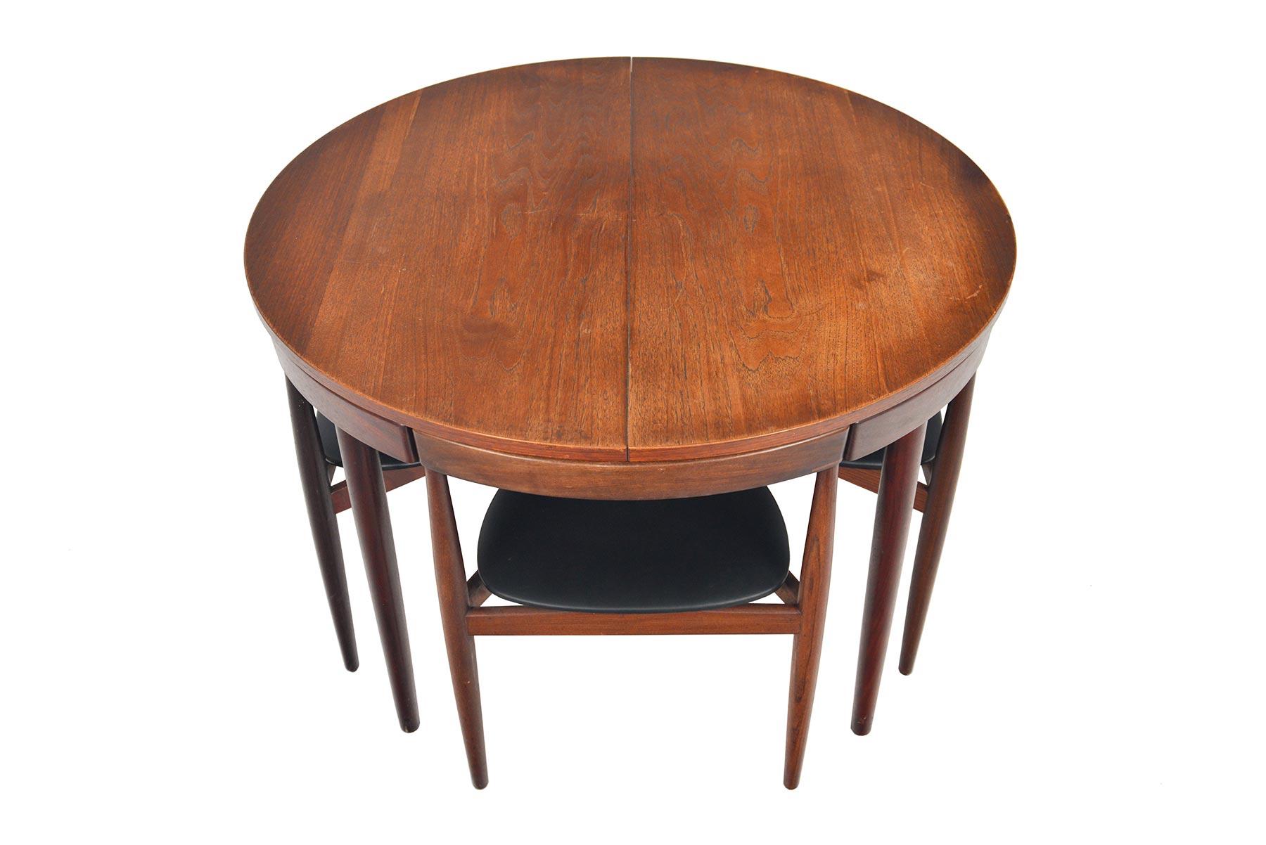 Origin: Denmark
Designer: Hans Olsen
Manufacturer: Frem Rojle
Era: 1960s
Dimensions: 41.5 diameter x 29 tall 
Expanded 61 long x 41.5 deep x 29 tall
Chairs 19 wide x 17 deep x 28 tall
Seat 16.5 wide x 16.5 deep x 17 tall 

Condition: Table