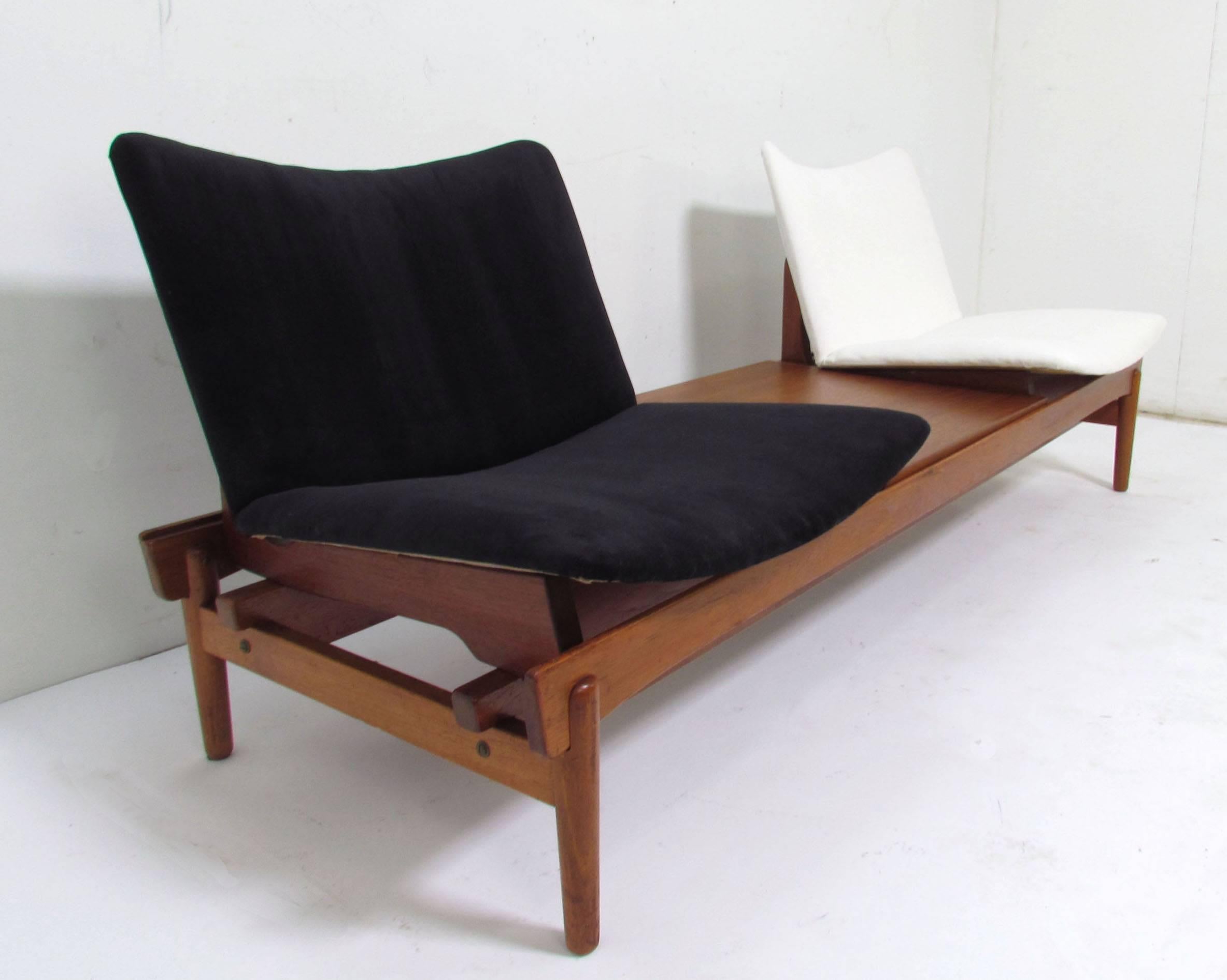 Scarce Danish two-seat sofa or bench designed by Hans Olsen for N.A. Jorgensens Mobelfabrik (Bramin), circa mid-1950s. Seats and tabletop can be reconfigured in various positions.