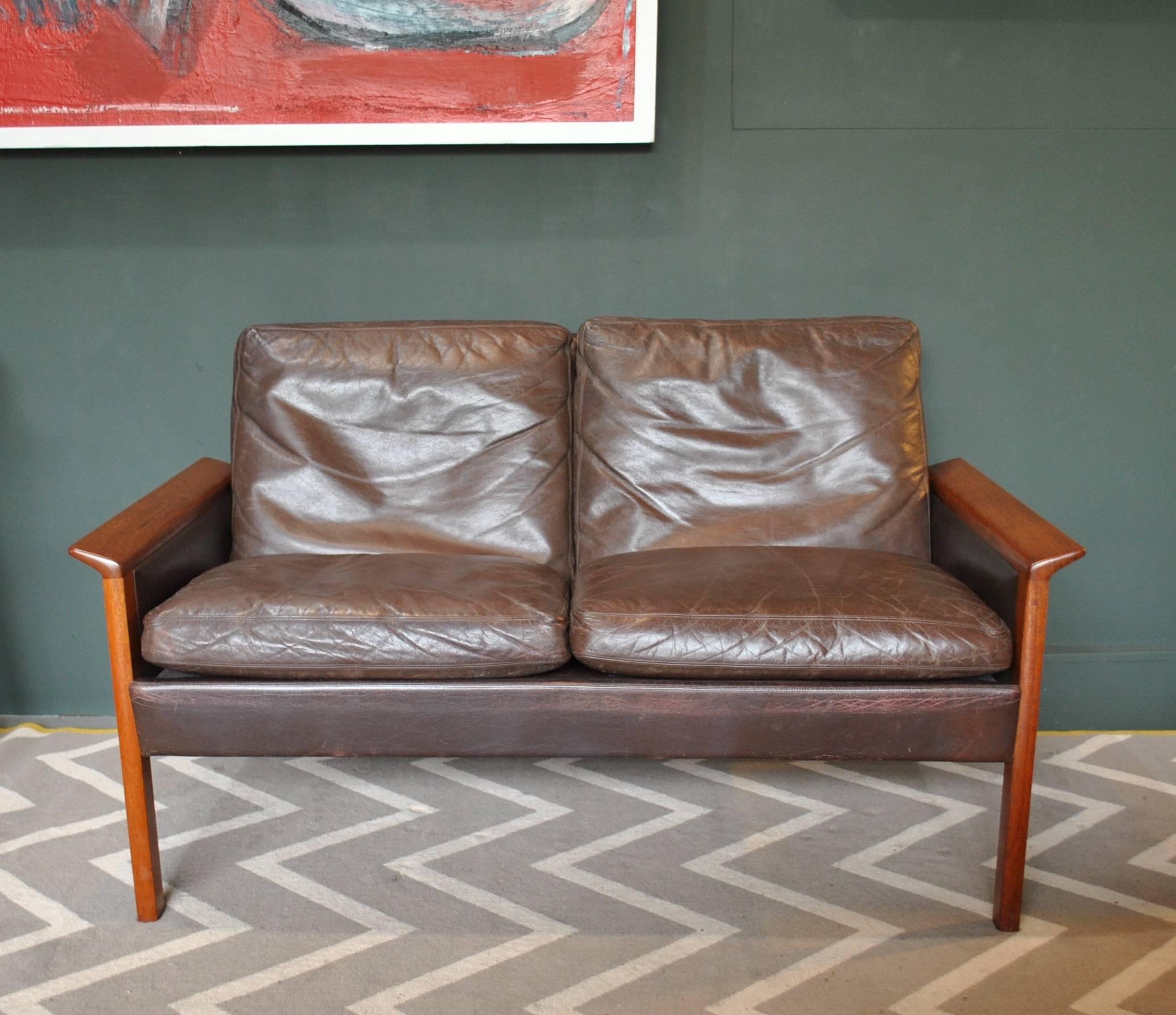 Rare teak frame model 500 two-seat sofa. This was designed by Hans Olsen for C.S Mobler, Denmark circa 1960. Mid-dark brown original patinated leather upholstery. This has been thoroughly cleaned and conditioned throughout. The teak frame has been