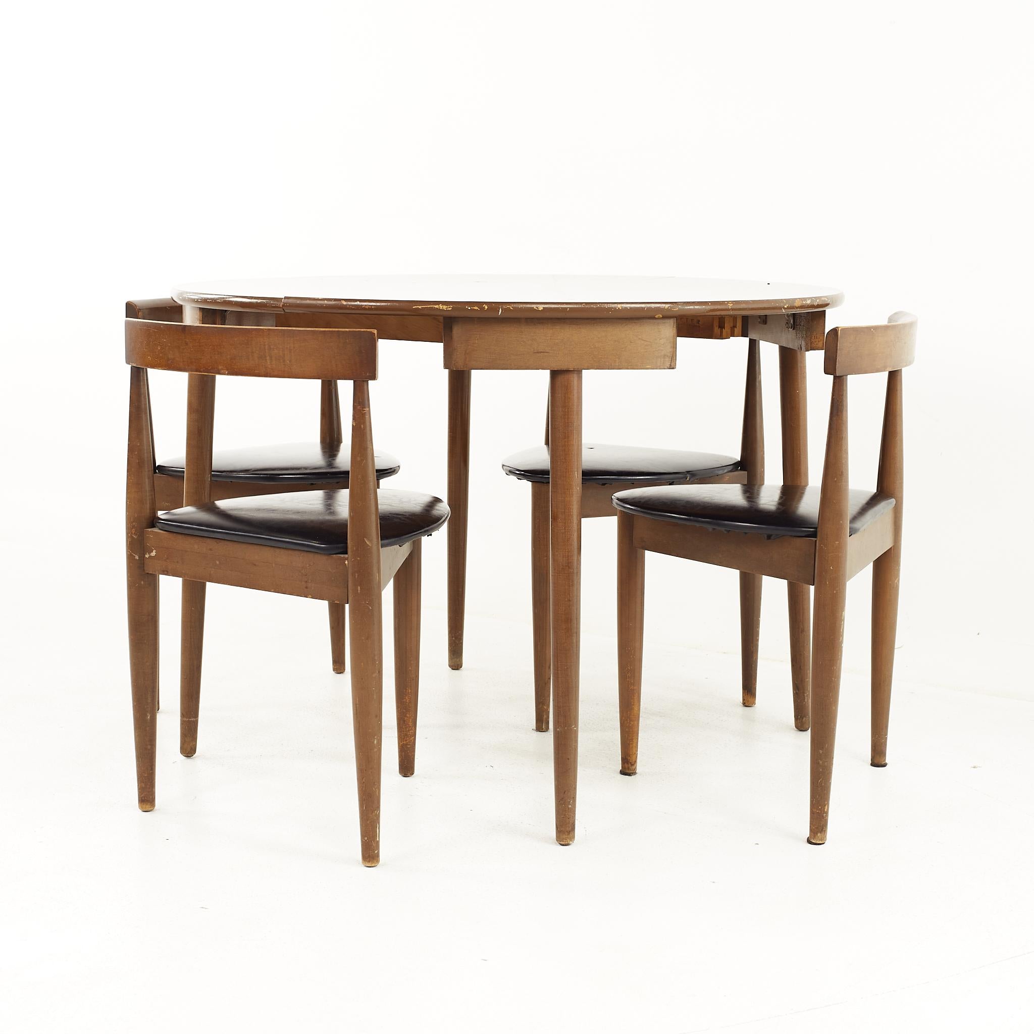 round dining table with nesting chairs